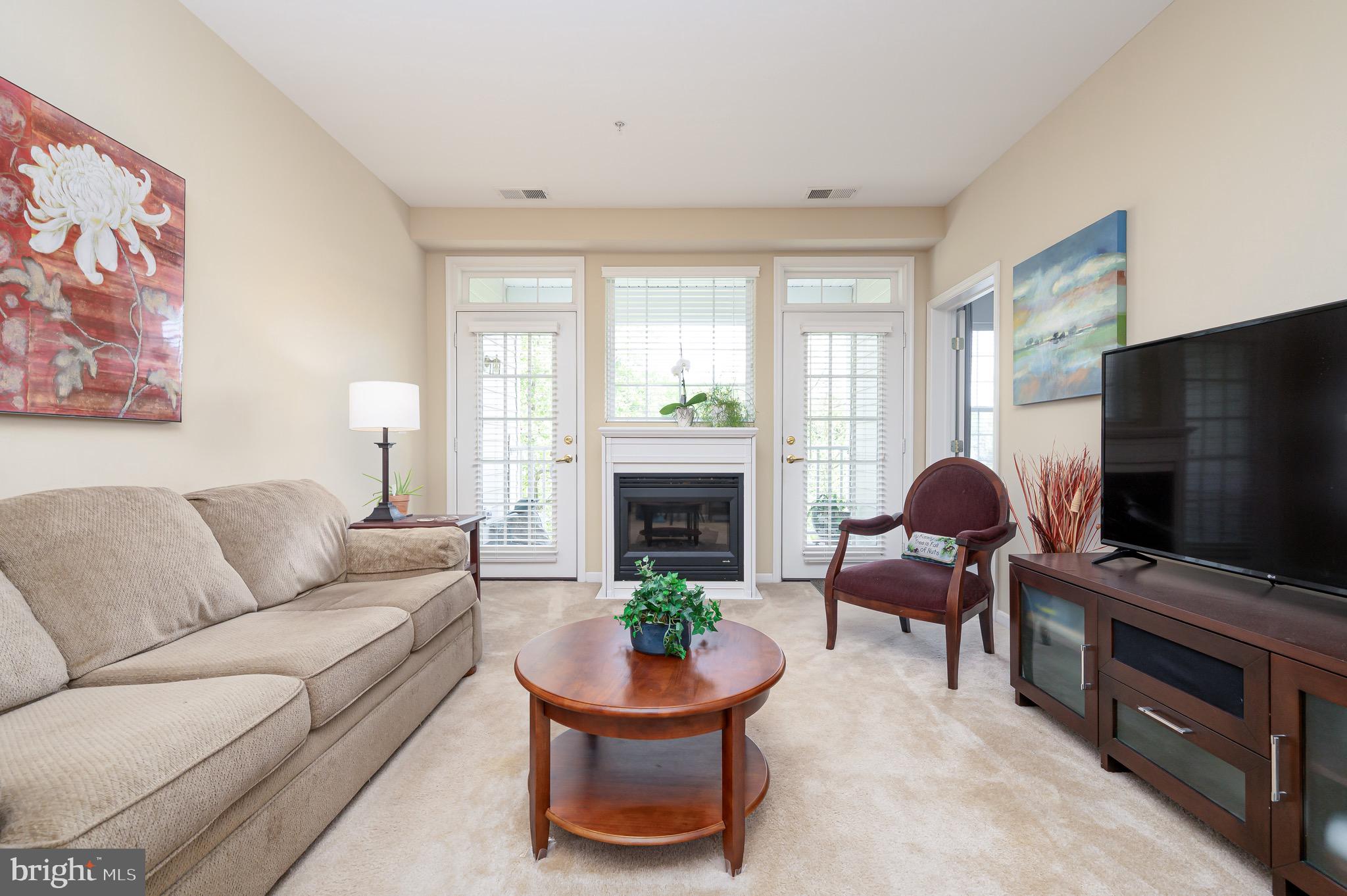 Welcome to your dream home in the heart of the vibrant 55+ community of The Hamlets at South River Colony! This stunning 2-bedroom, 2-bathroom condo, located at 410 Hamlet Club Dr, Edgewater, MD 21037, offers the perfect blend of modern comfort and low-maintenance living. Spanning approximately 1,550 sq. ft., this bright and airy residence boasts an open floor plan with 9-foot ceilings, cleaned carpet, and an inviting  fireplace in the spacious living room. The primary suite is a true retreat, complete with a walk-in closet. It features a luxurious ensuite bathroom with dual sinks, a soaking tub, and a walk-in shower. A second generously sized bedroom and full bathroom provide flexibility for guests or a home office. Enjoy your morning coffee or evening relaxation on the balcony, overlooking serene community views.
This move-in-ready condo includes a one-car garage with an additional parking space and convenient elevator access in a secure building. There have been recent upgrades to the  HVAC systems and Water heater within last 5 years. 

Community Amenities
The Hamlets at South River Colony offers an unparalleled lifestyle with resort-style amenities, including:
Two community pools for relaxation and recreation

Tennis and pickleball courts for active fun

Scenic walking and jogging paths

A community center and clubhouse for social gatherings

Tot lots and playgrounds for visiting family

Optional golf course membership for enthusiasts

Secure building entry and extra storage for peace of mind

Nearby Shops and Malls
Perfectly situated for convenience, 410 Hamlet Club Dr is within walking distance to a variety of popular shops and dining options. Explore local favorites such as:
Beautifully Wilde Boutique and The Twisted Bead for unique shopping experiences

Black Market Bakers, The Original Steakhouse, and Coopers Tavern for delicious dining

UPS Store and Edgewater Post Office for everyday needs

Giant Food and CVS Pharmacy for groceries and essentials

For larger shopping excursions, the condo is just a short drive from:
Westfield Annapolis Mall (approximately 4 miles away), featuring major retailers like Macy’s, Nordstrom, and Apple, along with a wide range of dining options

Annapolis Towne Centre (also about 4 miles away), offering upscale shops like Whole Foods, Target, and Anthropologie, plus restaurants such as True Food Kitchen and P.F. Chang’s