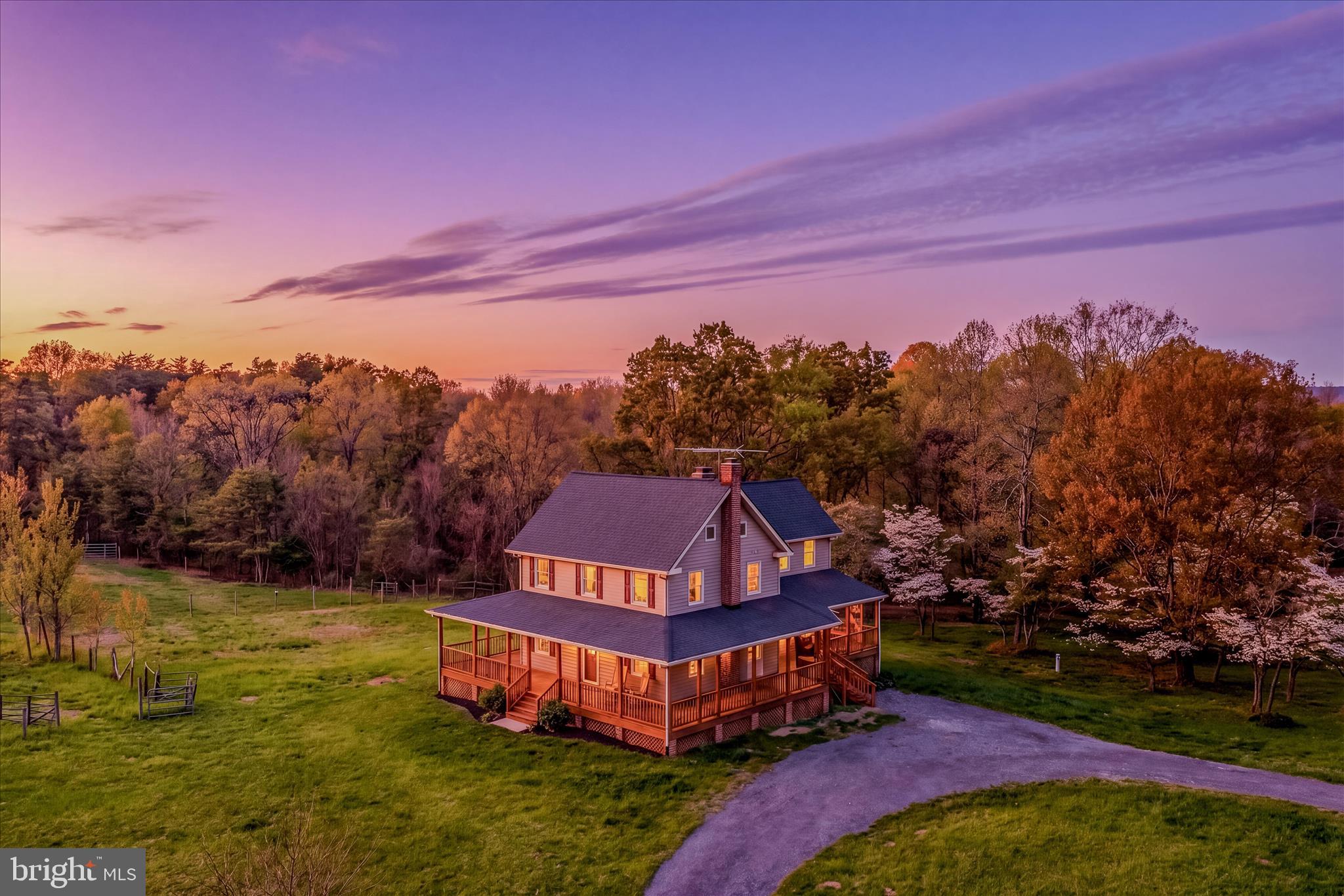 Multiple Offers Received ! Best and Final Due by Wednesday April 22nd by 12pm.  Escape to your own private West Virginia retreat at 344 Tub Run Hollow Rd, where a beautifully updated, solid custom-built home, wrap-around porch, and peaceful setting come together to create a truly special property. Tucked at the end of a quiet country lane, this homesite offers the privacy and tranquility you’ve been looking for.
The home has been thoughtfully updated, blending modern comfort with timeless country charm. Built with quality craftsmanship, this solid custom build offers durability you can feel the moment you walk in. Some recent improvements include two new HVAC systems and a 50-year architectural roof, providing comfort and peace of mind for years to come. Inside, you’ll find warm, inviting living spaces with fresh finishes, abundant natural light, and a layout that flows effortlessly for everyday living and entertaining. Multiple bedrooms with new carpets and brand new baths provide flexibility for family, guests, a home office, or hobby space.
Step outside and the wrap-around porch steals the show—perfect for morning coffee, evening sunsets, or simply taking in the peaceful surroundings. Just beyond the home, a large outbuilding adds incredible value and versatility, offering space for garage parking, a workshop, equipment storage, barn or a combination of all three.
Set on its own 12.96 acres, this property offers the perfect balance of privacy, usability, and low-maintenance country living. Located in desirable Berkeley County, you’ll enjoy that “away from it all” feel while still being within a convenient drive to Martinsburg, local amenities, and major commuter routes.
If you’ve been searching for an updated, move-in ready home with incredible porch living, a functional outbuilding, and the confidence of a solid custom build, 344 Tub Run Hollow Rd is a must-see.