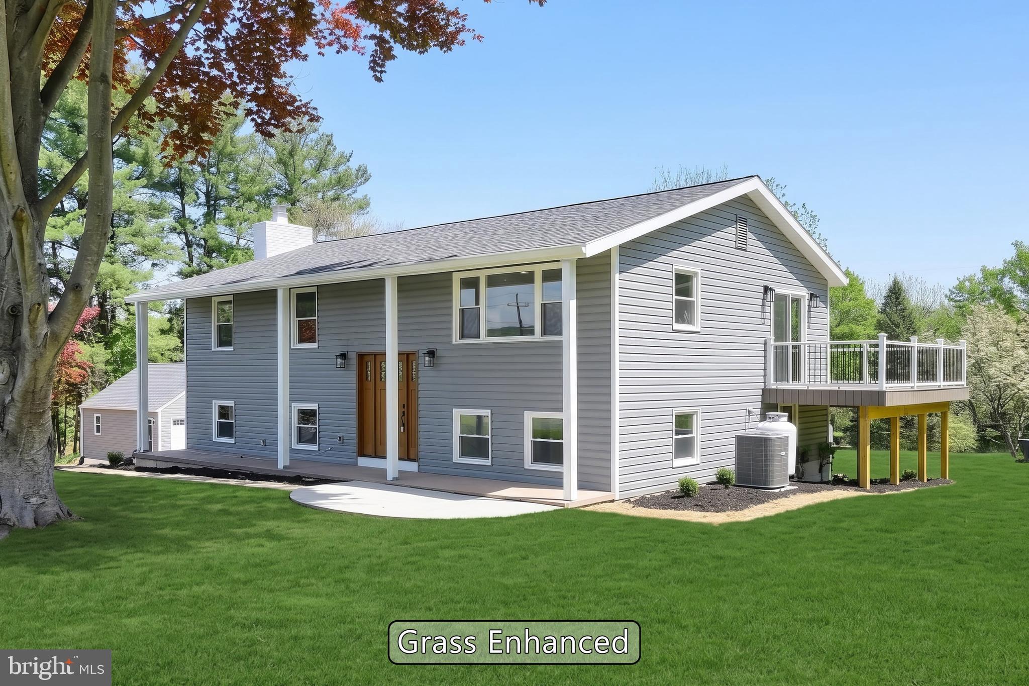 Welcome to 823 Baltimore Rd., a fully renovated 4-bedroom, 2-full-bath raised ranch offering 2,352 total finished square feet on a flat, completely usable 1.61-acre lot in Dillsburg's Northern York County School District. This is not a paint-and-flip — this is a full rebuild from the outside in. New roof, new siding, new windows, new HVAC, new kitchen, and both bathrooms taken down to studs and rebuilt with modern, high-end finishes throughout. The main level lives bright and open, with clean lines, updated flooring, and a layout that works whether you are hosting or relaxing. The finished lower level adds real living space — ideal for a family room, home office, guest setup, or rec room — and the fireplace adds a warm anchor on cooler evenings. Step outside and the property really opens up. A brand new deck wraps from the back of the home around the side, giving you multiple spots to grill, entertain, or take in the yard. The landscaping has been refreshed top to bottom, the lot itself is flat and easy to use, and the freshly seal-coated driveway offers serious parking. The detached garage has been fully redone to match the styling of the house, fully insulated, and equipped with a brand new mini split for year-round heat and AC — perfect for a workshop, car projects, a home gym, or a studio. A separate storage shed with a refreshed exterior handles your outdoor storage needs on top of the conditioned garage. 823 Baltimore is truly turn-key. Just bring your furniture.