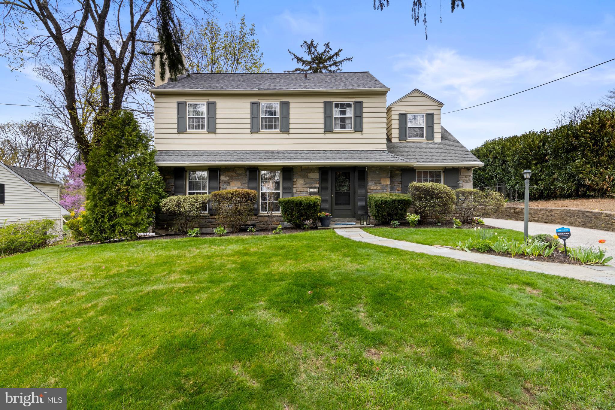 A rare find in the heart of walkable South Wayne, this charming 4 Bedroom, 2/1 Bath Colonial sits on a scenic 1/3-acre lot and offers the perfect blend of classic character, comfortable living space, and an unbeatable location. Step inside to a welcoming layout featuring a spacious Living Room with a fireplace—ideal for relaxing or entertaining. A dedicated first-floor Office with a wall of built-in bookshelves provides the perfect work-from-home space (or playroom/guest bedroom). The large Dining Room flows beautifully for gatherings and opens through glass doors to a flagstone patio overlooking the picturesque backyard.

The bright Kitchen offers solid wood cabinetry, granite countertops, new stainless steel frig, dishwasher and microwave, ample counterspace with breakfast bar seating, a breakfast room, and a built-in desk/bar area —perfect for casual dining, work, or entertaining. Just off the Kitchen, the sun-filled Family Room provides wonderful additional living space with a second fireplace and ample storage.

Upstairs, the Primary Bedroom features a walk-in closet and an updated en-suite Bath. Three additional Bedrooms share a Hall Bath. The large unfinished Basement, with high ceilings and walk-up access to the side yard, offers excellent storage and excellent potential for future finished living space. An oversized detached two-car Garage adds even more storage and convenience.

Located within walking distance to shops, restaurants, schools, parks, and train stations, this home offers unparalleled convenience in the highly ranked Radnor School District. Enjoy easy access to the Blue Route, Center City, medical and corporate centers, and the Airport, while also being just steps from beloved local events like South Wayne Porchfest, the Wayne Music Festival, Radnor Fall Festival, and Wheels of Wayne. This is a rare opportunity to own a beautiful home in one of Wayne’s most sought-after neighborhoods.