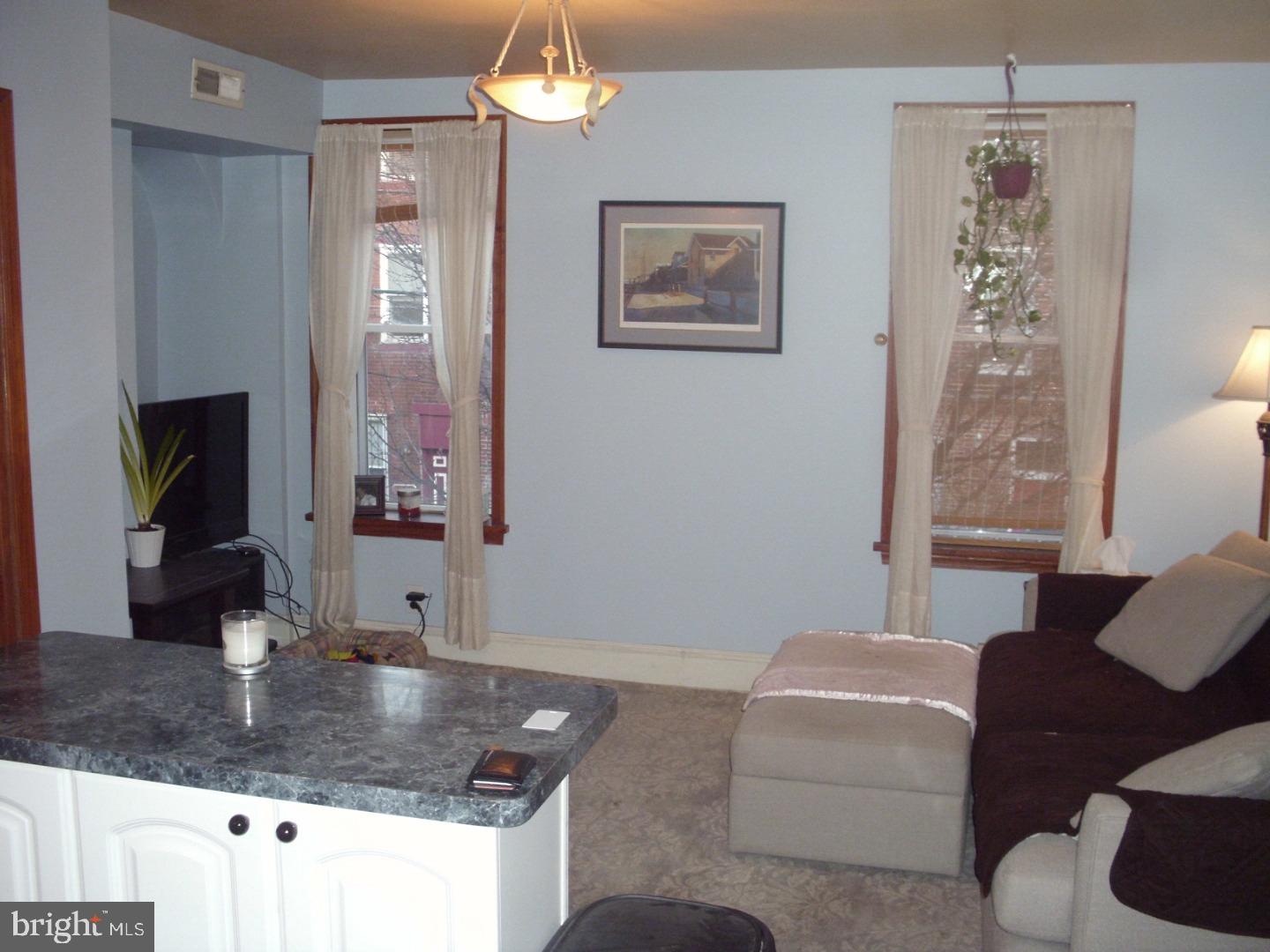 Welcome to this spacious 1 bedroom apartment that occupies the top two floors of a 2 unit building situated in a convenient and desirable Graduate Hospital location.  Located between Fitzwater and Catharaine, it's but a short walk from Rittenhouse Square and all that it has to offer as well as all of the offerings on South Street and throughout the neighborhood.  This apartment has a large kitchen, hardwood floors, a laundry room, an extra 1/2 bath, a new central air/hot air HVAC system, and a great deck with city views.  The office/DR can be transformed into a 2nd bedroom, if desired.