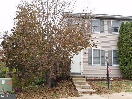 Warm, inviting rooms with newer paint and carpet  throughout, tucked on a quiet cul-de-sac.  Enjoy the elevated deck or the daylight walkout basement opening to a brick patio, both overlooking wooded rear yard with stream.  Large eat in kitchen with cherry cabinets and ceramic tile floor. Full finished basement with laundry room.