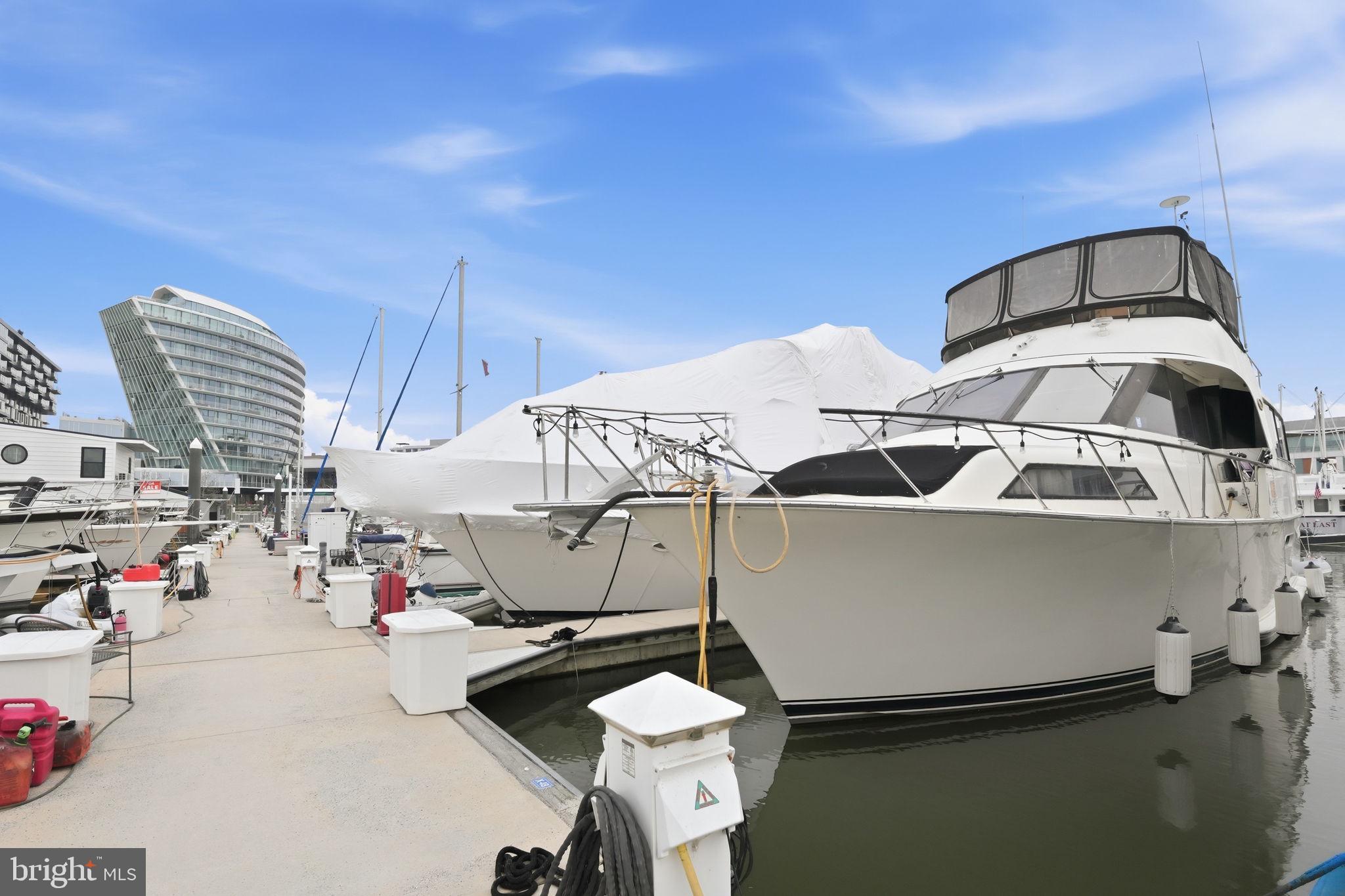 Welcome aboard this impressive 60-foot Ocean Yacht, powered by twin Detroit Diesel 8V92 engines that can comfortably cruise the Chesapeake Bay or take you all the way to the Bahamas. Combining adventure with everyday comfort, this floating residence offers an extraordinary opportunity to live directly on the water in the heart of Washington, DC.

Inside, the yacht features four bedrooms and four bathrooms, providing far more space than most waterfront condos in the city. It raises a compelling question: why spend $1 million for a one-bedroom overlooking the water when you could live on the water for $365,000—with four bedrooms and endless character?

Owners enjoy full access to the amenities at the Wharf Marina, including a 24-hour staffed front desk, security, clubhouse, showers, laundry facilities, and a welcoming community atmosphere.

Step off the dock and you’re immediately immersed in everything The Wharf has to offer—award-winning restaurants, waterfront bars, and live entertainment. Enjoy performances at The Anthem or Arena Stage, catch a game at Nationals Park or Audi Field, and easily commute anywhere in the city via the nearby Waterfront station.

Whether you're a professional seeking a distinctive lifestyle, or a downsizer looking for low-maintenance living with personality and charm, this floating home offers rare value, comfort, and adventure in one of the most vibrant waterfront communities in the country.

Come aboard—your next chapter begins here. The liveaboard life at the Wharf is really fun! 

Note: Short-term rentals are not permitted at The Wharf.
