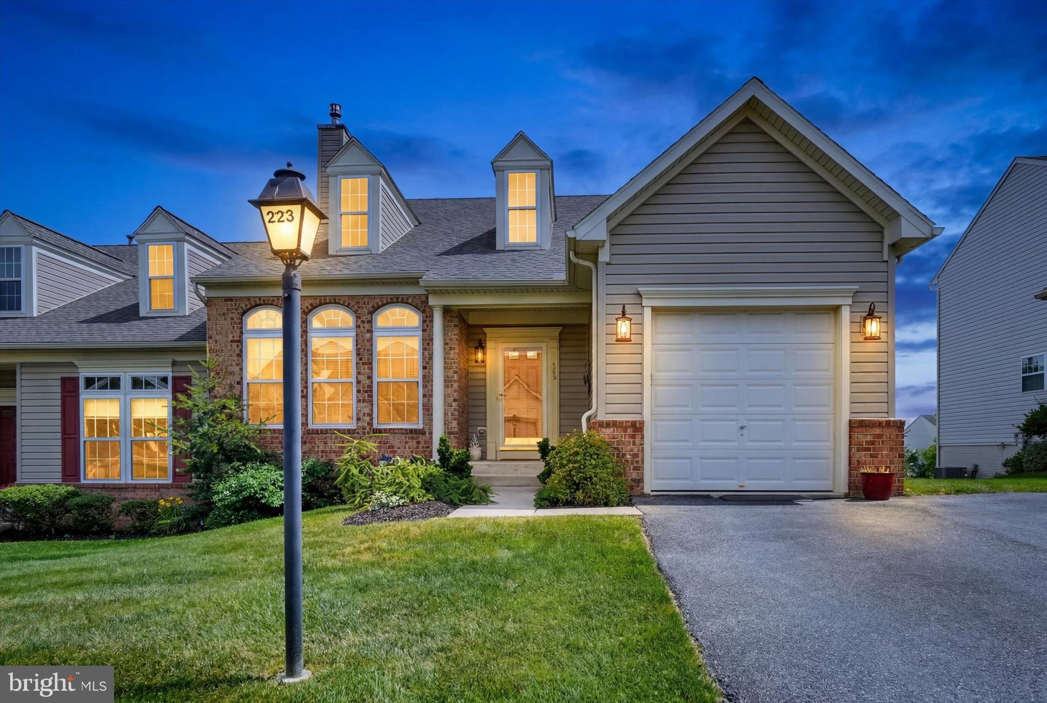 Prepare to fall in love at 223 Fairmount Ct. in Shrewsbury! This large, light filled condo has been beautifully appointed and meticulously maintained, and boasts a rare walk-out lower level with stairs to a huge composite deck ready for memorable summer gatherings. Tidy gardens frame the front entrance, which opens to a dramatic 2-story great room with skylights, rich hardwood floors extending throughout the main living areas, and a distinctive 3-sided fireplace between the great room and formal dining room area. The bright, well-designed kitchen flows smoothly from the dining room area, and will delight your inner chef with ample cabinetry and quartz counters, gas cook top, premium SS appliances including built-in double wall ovens, a pantry, center island and breakfast nook with floor-to-ceiling windows and glass door to the deck. The first floor primary suite awaits with an elegant tray ceiling, walk-in closet and deluxe bath with a double vanity, soaking tub and an oversized glass and tile shower with built-in seat. Upstairs, the loft area provides a convenient flex space with striking views of the main level, and leads to two generous bedrooms and a full tile bath with tub shower. The full, finished lower level provides an impressive addition to your living space complete with surround sound in the family room ready for your home theater aspirations, a dining or billiard area, professional office and powder room. The one-car garage is supplemented by private driveway parking for 2 vehicles, and dedicated guest parking throughout the neighborhood. Top it off with a fantastic location, ideally positioned to enjoy the small town charms of Main St, Shrewsbury, and the convenience of major shopping, many dining options and I-83 access, all within a mile radius. The best of worry-free condo living is yours here. Just unpack, relax and enjoy!