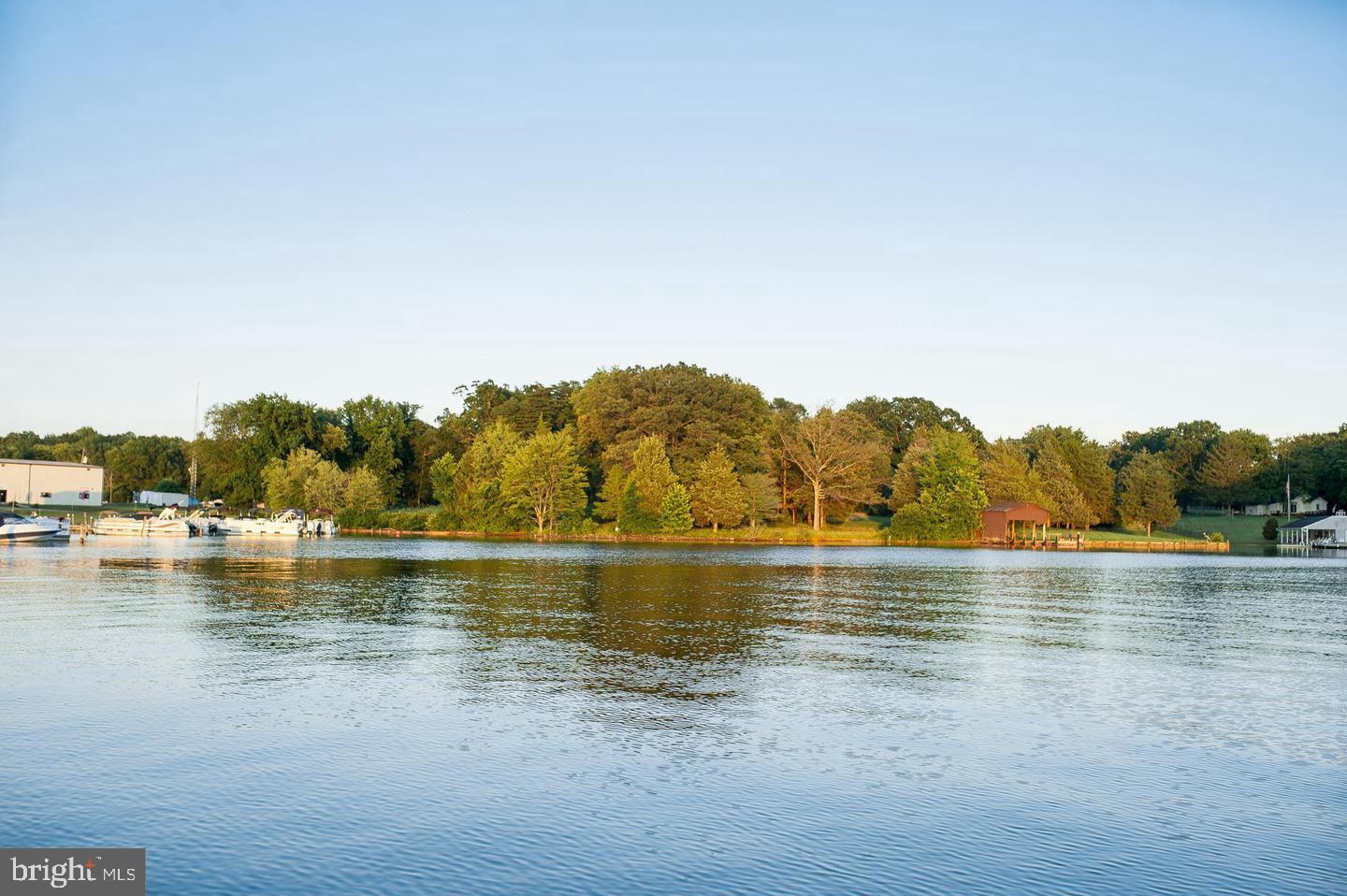 Over 4  Commercial acres with vepco shoreline, adjacent to Pleasants Landing Marina.  Endless possibilities!!! The property conveys with a 3BR, 2 1/2BA home with attached and detached garage and several outbuilding, gazebo and boat house with approx. 725+ft of sandy Lake Anna shoreline. Large views with great development potential.