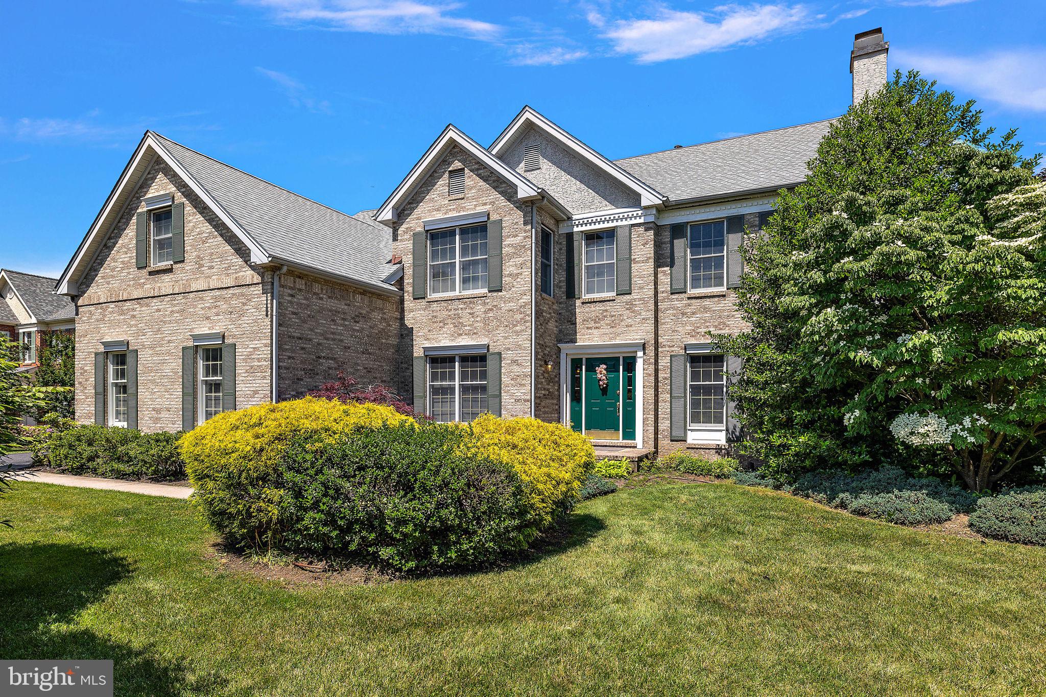 Welcome to 525 Annadale Drive, a stately brick Colonial home nestled in the highly sought-after Tredyffrin-Easttown School District. As you step into the large, beautiful foyer, you’ll be greeted by the warmth of hardwood flooring that flows throughout the entire first floor. Behind double doors, a private study with dark cherry built-ins offers a quiet retreat. The expansive living room, just off the front door, features detailed wallpaper, chair railing, a focal fireplace, and an overhead beam with recessed lighting, adding depth between this space and the attached formal dining room. The kitchen is a chef's dream with white cabinets, granite countertops, a large island with seating, stainless steel appliances, white double wall ovens, a white tile backsplash, recessed lighting, and a spacious pantry. A large open passthrough overlooks the bright sunroom, wrapped in windows, perfect for soaking in natural light. The serving station with electrical outlets separates the eat-in breakfast space from the family room, which boasts a two-story ceiling, a focal brick fireplace, and a rear set of stairs leading to the second floor. The first floor is completed by a powder room and a separate laundry room/mudroom combo. Upstairs, the large master suite features a sitting area and a huge walk-in closet. The master bath is a luxurious escape with tile flooring, a large soaking tub, a walk-in tile shower, and his-and-hers separate vanities. Down the hall, you'll find three additional bedrooms, one with a Jack and Jill bathroom, and the last with a conveniently located hall bathroom. The basement, with its 9 ft. ceilings, is ready for your finishing touches.  Outside, a large rear deck offers a private oasis with a tree-lined lot and beautiful mature landscaping and flower beds. This home is a perfect blend of classic elegance and modern amenities, ideal for comfortable living and entertaining. Close to major routes of transportation, restaurants, shoppes & boutiques. This is one you are going to want to call home!