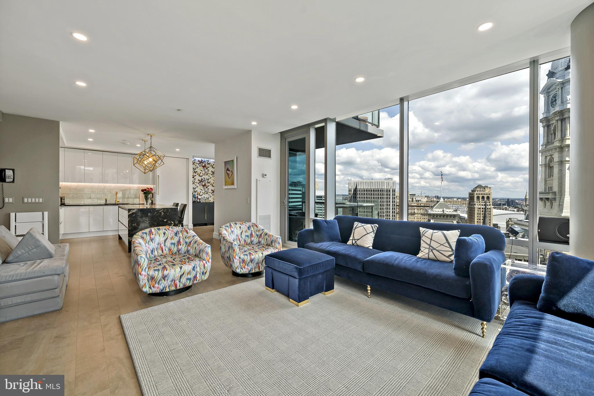 PARKING IS INCLUDED! PARKING VALUED OVER $100,000.  FULLY RENOVATED – Luxury Condo 3BR, 3.5 Bath, Balcony at The Ritz Carlton Residences This unit was gutted & fully renovated including Joanne Hudson kitchen, Ann Saks bathrooms, Mirage and Stark flooring – soup to nuts renovation! The unit features many high end design features and state of the art technology that include: Kitchen: Gaggenau Convection Oven, Gaggenau Oven/Microwave Combo, Gaggenau Five-Burner Brass Gas Cooktop with Wok burner, Fully Vented Hidden Gaggenau Range Hood, Kallista Faucets, Ann Sacks Marble Tile Glass Backsplash, Joanne Hudson Kitchen with Downsview white lacquer millwork and granite waterfall island and Kelly Wearstler Visual Comfort Lighting Fixtures Bathrooms and Powered Room: Kallista Faucets and Sinks, Ann Sacks Marble Tile, Kelly Wearstler Marble Mosaic Tile Flooring: Mirage Wood Floors Through Foyer, Kitchen, Living, Dining and 2nd/3rd Bedrooms and custom Herringbone Wood Through Foyer and Stark Carpeting in Master Bedroom Lighting: Recessed LED lighting throughout household and LED acccent lighting with RGB color options in kitchen, living, dining, and all bedrooms plus Kelly Wearstler Visual Comfort Lighting Fixtures in Kitchen, Bathrooms, and Primary Bedroom Closets and Storage: California Closets throughout all closets, California Closets built-in millwork in all bedrooms with granite tops in 2nd/3rd bedrooms Design: Kelly Wearstler and Christian Lacroix Wallpaper Throughout & Nero Marquina Marble mantle with European Home Gas Fireplace Technology: Complete Smart Home with Controllable Lutron Lighting, Audio/Video Systems, Fireplace, & HVAC Invisible Speaker Surround Sound System - Inside walls and ceiling ElectroLux Extra Large Washer & Dryer Fully concealed sprinkler system Fiber Optic Internet The Ritz-Carlton Residences with distinctive attention to details and design. This 3 Bedrooms, 3 1/2 Baths unit features a balcony with views of Dilworth Park and City Hall Clock Tower. The Ritz offers some of the best amenities in the city, such as: Chauffeur-driven town car, State of the Art Fitness Center with 54 ft. Lap Pool and Yoga Room, Gated Landscaped Garden with 12ft. Water Wall, 24 hr. Concierge and Front Doorman, newly renovated Residents Lounge & Media Room and dog run. 1 parking spot included in listing **2nd car parking spot available for additional fee**