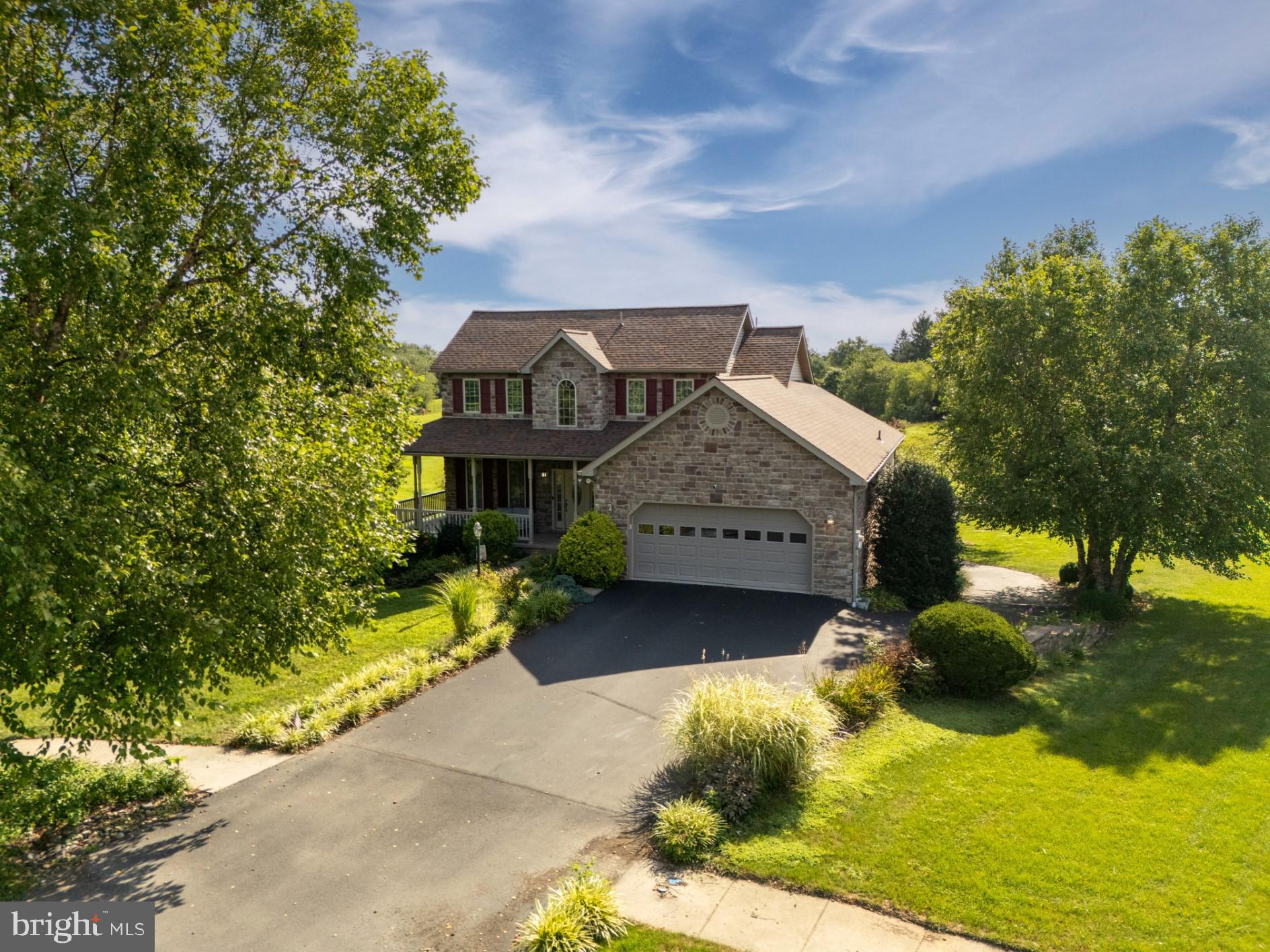 Step into 1458 Highfield Court and discover a charming stone home surrounded by beautiful, lush landscaping.  This three-story property features four bedrooms, three bathrooms, and a fenced yard. The interior boasts hardwood floors on the main level, with new carpeting installed upstairs and downstairs.  The primary suite, located on the main level, features a large walk-in closet and bathroom with large tub. The spacious kitchen has all new appliance package.  The property showcases extensive hardscape, a serene backyard, amazing views, and a lower garage out-back providing additional storage.