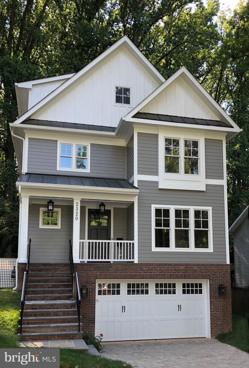 **Price Reduced to an exceptional value! *****Sited on a wooded lot  in the sought after Lee Heights neighborhood, this  new Spring Street home offers four finished levels and a versatile floorplan.  Lower level rec room and 5th bedroom have separate laundry area and plumbed and wired for kitchenette.   With a private entrance, it is ideal for an in law, au pair, or income producing English basement rental.   Walk to shops, restaurants, schools.   "Two lights to DC"  convenience, plus Donaldson Run swim club area.*********Inviting foyer leads to living room or traditional dining room with adjoining butler's pantry and walk-in kitchen pantry. Double doors with sidelights  in family room lead to private, flat yard with mature trees and shrubbery.  A true oasis yet blocks to Starbucks! ***Breakfast area, gorgeous kitchen, and family room span back of home and offer private views.***Upstairs, the master bedroom features an en suite bathroom with double bowl vanity and  soaking tub along with a walk-in closet with organizers.  Two more bedrooms, bathroom, and laundry room with washer and dryer complete this level***The top floor is given over to a big bonus room with dormered ceilings, the fourth bedroom and bathroom.***In the lower level, the oversized two car garage has entry to a mudroom with built-ins (even electronic device chargers),**Wood floors main and upper level, gas fireplace  in family room; extensive moldings, wainscoting, quality details, and thoughtful touches that are the hallmark of a Spring Street home.*******.