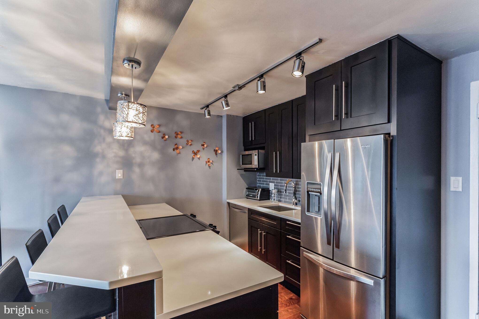 FABULOUS 1 Bedroom, 1 Bathroom condo in the heart of Center City! Located in the Academy House, this newly renovated unit offers a bright open floor plan with a south-facing view, and a french balcony overlooking the Kimmel Center! There are gorgeous hardwood floors throughout, and a completely renovated Kitchen and Bath. The Kitchen features beautiful Quartz countertops with decorative subway-tile backsplash, sleek shaker-style cabinetry, stainless-steel appliances, and a 9-foot breakfast bar with seating x4. The Bedroom has a walk-in closet and a linen closet for additional storage! The remodeled bathroom features a marble walk-in shower with glass door, dual sinks, and a stackable washer/dryer. The Academy House amenities include an indoor pool, fitness center, courtyard/sundeck, and a 24-hour concierge. STUNNING City Views! Unbeatable Location—just off the Avenue of the Arts (Academy of Music, Kimmel Center, etc.), and blocks from Rittenhouse Square with easy access to public transportation. You’ll be steps from the city’s best restaurants, numerous shopping, and vibrant nightlife! Call now for your personal showing!