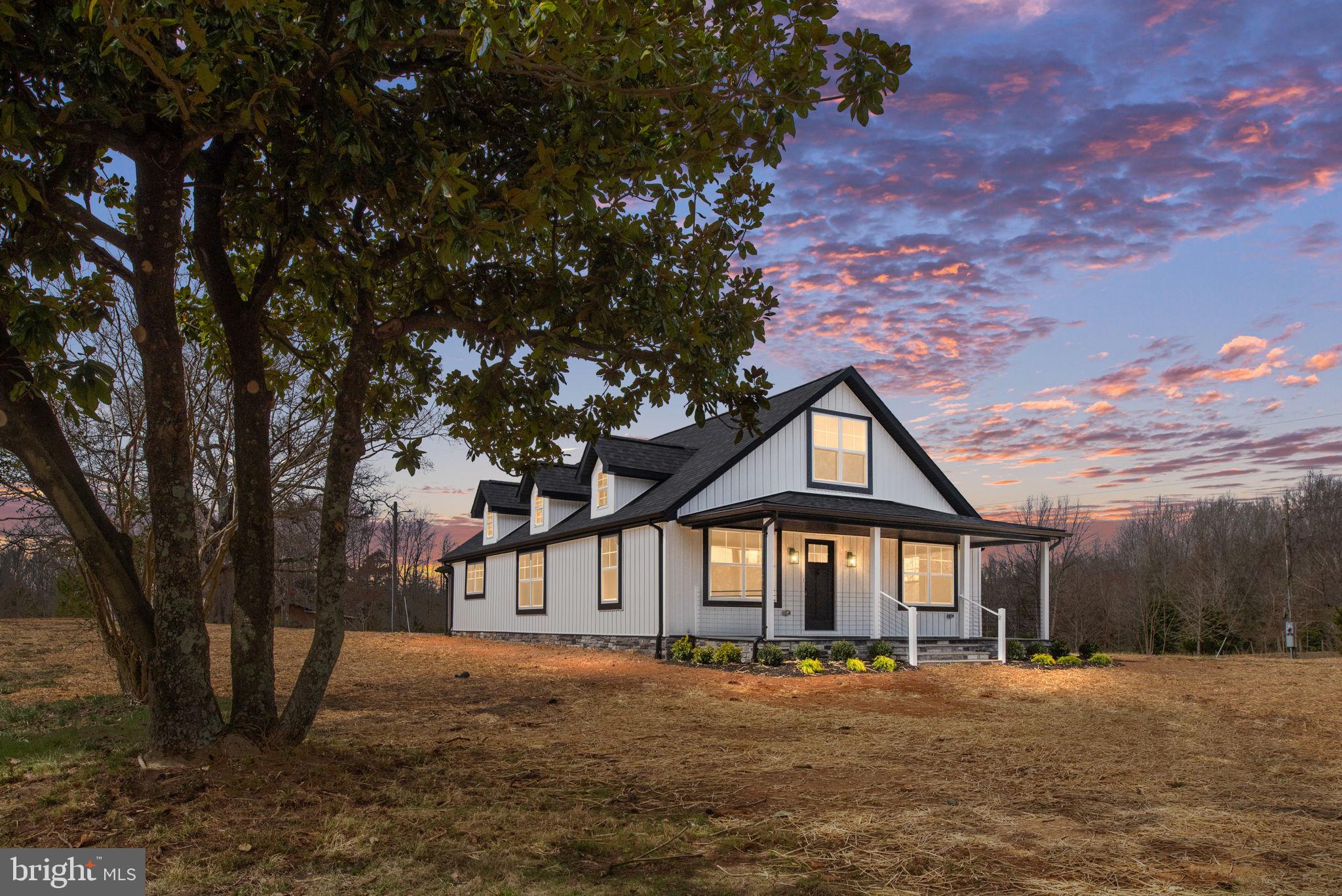 This stunning 4-bedroom, 3-bathroom home has been remodeled from top to bottom, blending modern updates with farmhouse charm. Situated on nearly 5 acres of usable land, this property is ready for you to create your dream homestead or farmette.

The main level features an inviting open-concept design with LVP flooring throughout the main living areas. The spacious living room, dining area, and gorgeous kitchen flow seamlessly together. The kitchen boasts two-toned cabinetry, quartz countertops, a large eat-up island, and ample storage space. The main level also includes two generously sized bedrooms, including a primary suite with double closets, a spa-like ensuite bathroom with a large tiled walk-in shower, marble tile flooring, and a double vanity. A second full bathroom completes the main floor.

Upstairs, you’ll find two additional spacious bedrooms and another full bathroom. Relax on the covered front porch or enjoy the serene views from the back patio overlooking your property.

Additional features include a circular driveway, a new well, and a one-car detached garage, perfect for storage, hobbies, or a workshop. Conveniently located just minutes from the Spotsylvania VRE, I-95, shopping, and a variety of restaurants, this home offers the perfect balance of privacy and accessibility.

This fully remodeled home on 4.37 acres offers endless possibilities—schedule your showing today!
