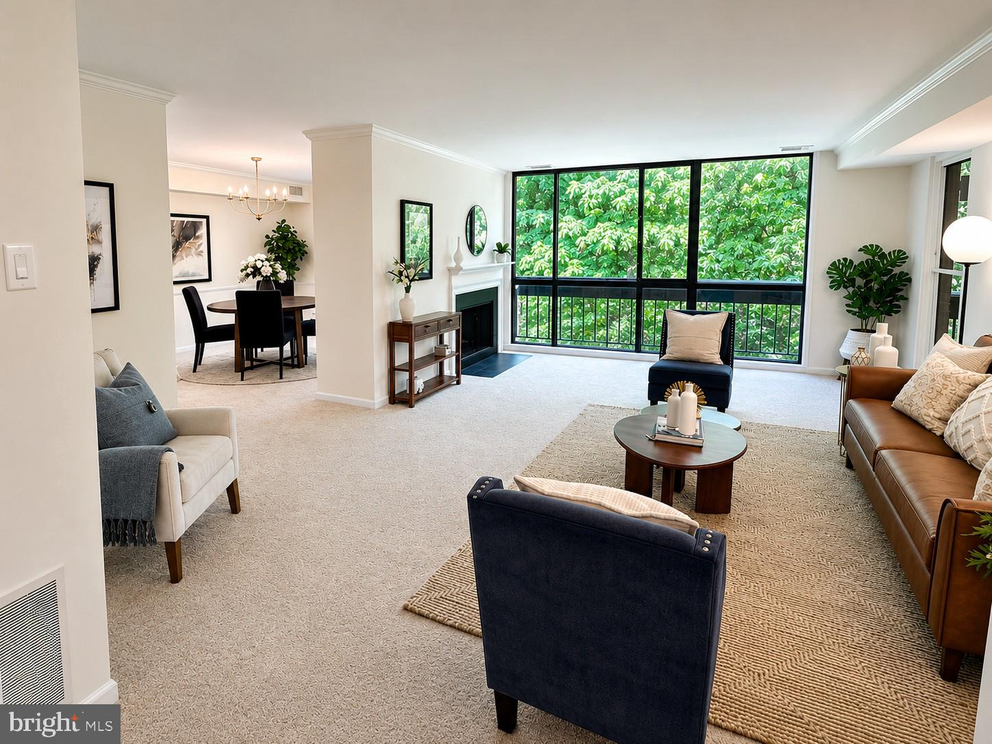 Nestled in the highly desirable Sumner Village community, this beautifully renovated 2-bedroom, 2-bath condominium offers the perfect blend of comfort, style, and convenience. Walls of glass frame serene sylvan views from every room and fill the home with natural light, creating a warm and inviting atmosphere throughout the thoughtfully designed 1,491 square feet of living space. The newly updated, table-spaced kitchen has new appliances, quartz countertops, tons of cabinet space, and opens through French doors to a separate dining room.  Freshly painted with new flooring and lighting throughout, this home is truly move-in ready. The spacious living room is anchored by a cozy wood-burning fireplace and opens to a generous private balcony overlooking a picturesque courtyard—an ideal setting for morning coffee or relaxing evenings surrounded by nature and birdsong. Additional highlights include in-unit laundry, extra storage, and secure building access. Residents enjoy an exceptional array of community amenities, including an outdoor pool, tennis courts, clubhouse, scenic jogging and walking paths woven throughout the beautifully landscaped grounds, with parking right outside your door. Experience low-maintenance living with the charm, tranquility, and vibrant lifestyle that make Sumner Village such a special place to call home.