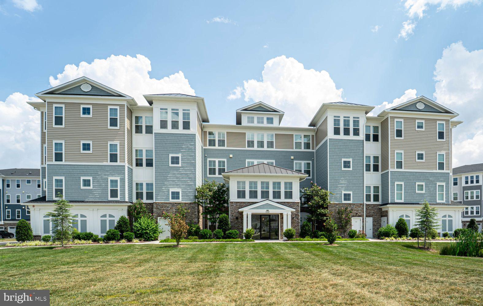 Welcome to Luxury Condo Living at The Four Seasons at  Kent Island, An active 55+ Community packed with tons of amenities . Move -in to this turn key luxury condo with plenty of natural light with "Perfect Fit"  planation shutters and ample privacy on all windows and doors. The kitchen has a gourmet package including quartz countertops and a large island with space for barstool eating, subway tile backsplash, staggered cabinets, and stainless steel modern appliances. The great room has a seasonal view of the Chester River and a traditional electric fire place with shiplap accents fostering a feeling of warmth and tranquility. The primary bedroom/bathroom is spacious with two sizeable walk-in closets. The primary bedroom also includes attached sitting room with water-view and access to the balcony overlooking a pond that attracts wildlife. All bedrooms of this Severn Model offer custom closets designed and constructed by "Chesapeake Closets". The unit comes with a first floor assigned one car garage and an assigned climate-controlled storage closet. Come join the easy life! Call for your private showing!
