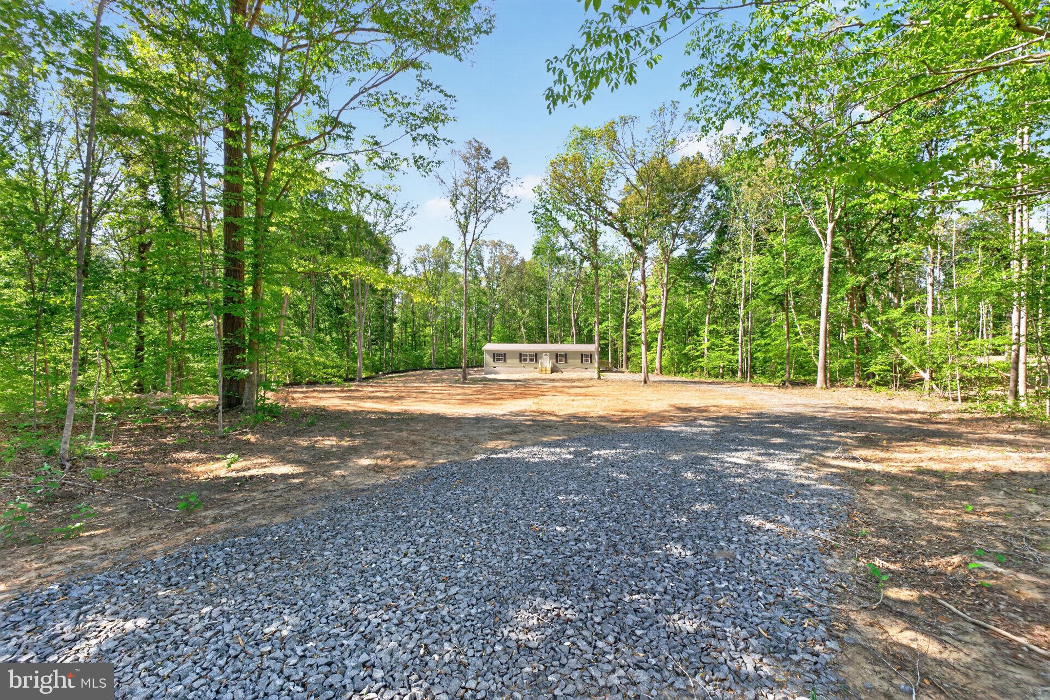 Brand new construction offering the ease of one-level living on a private 3.19 acre lot! This beautifully designed home features 3 bedrooms and 2 full baths with an open and functional layout perfect for everyday living. Enjoy the peaceful setting surrounded by mature trees while still having plenty of open yard space to relax, entertain, or enjoy nature. Inside, you’ll find bright living areas, a spacious kitchen, and a desirable split-bedroom design for added privacy. The primary suite includes a full private bath, while the additional bedrooms offer flexibility for family, guests, or a home office. Step outside and enjoy the level lot with room to garden, play, or simply take in the quiet country setting. The yard will be professionally graded, seeded, and strawed upon completion, making this property move-in ready inside and out.
If you’re looking for low-maintenance, one-level living with privacy and acreage, this new construction home is a must-see!