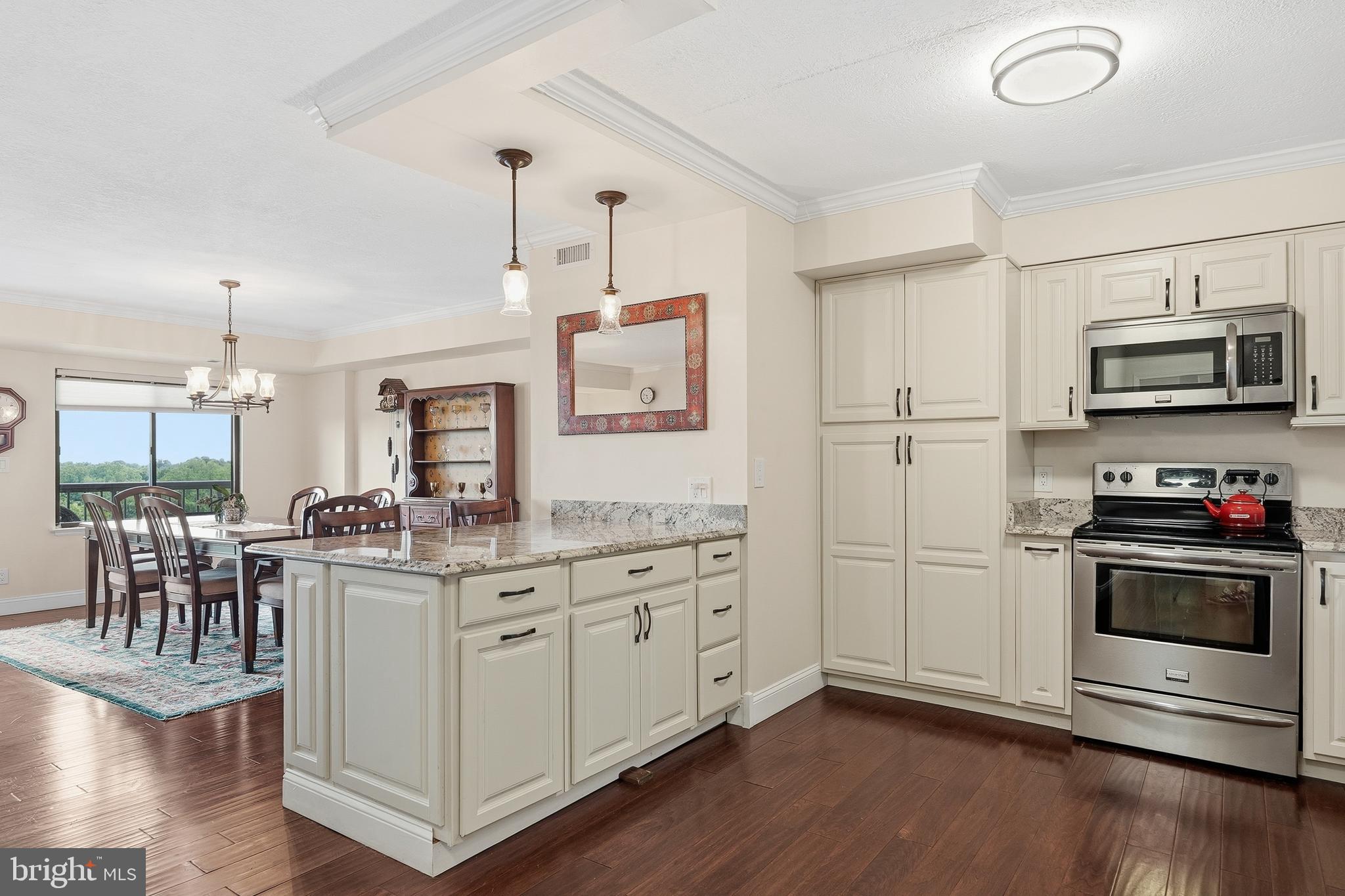 Spacious, stylish, and exceptionally connected, this beautifully updated two-bedroom, two-bath residence offers the best of both worlds: an open-concept layout with distinct living, dining, and kitchen spaces designed for comfortable everyday living and effortless entertaining. The well-appointed kitchen features granite countertops, a breakfast bar, all stainless-steel appliances, plentiful storage, and a built-in desk station—perfect for work, organization, or meal planning.

Thoughtfully renovated with comfort in mind, the home includes added soundproofing throughout, creating a remarkably quiet living environment. A private balcony overlooks a canopy of trees, offering a peaceful retreat, while the generous primary suite features a walk-in closet and abundant storage. One assigned covered parking space also conveys.

Beyond the front door, enjoy a true resort-style lifestyle. This full-service community offers concierge service, club and community rooms, a resident lounge, fitness centers, indoor and outdoor pools, a hot tub, sauna, steam room, tennis courts, playgrounds, picnic areas, on-site daycare, barber services, storage, and more.

Perfectly positioned on a direct bus line to the Pentagon Metro, with quick access to Washington, DC, local airports and nearby Amtrak stations, this home delivers the rare combination of space, amenities, convenience, and value—all in one highly sought-after address.
