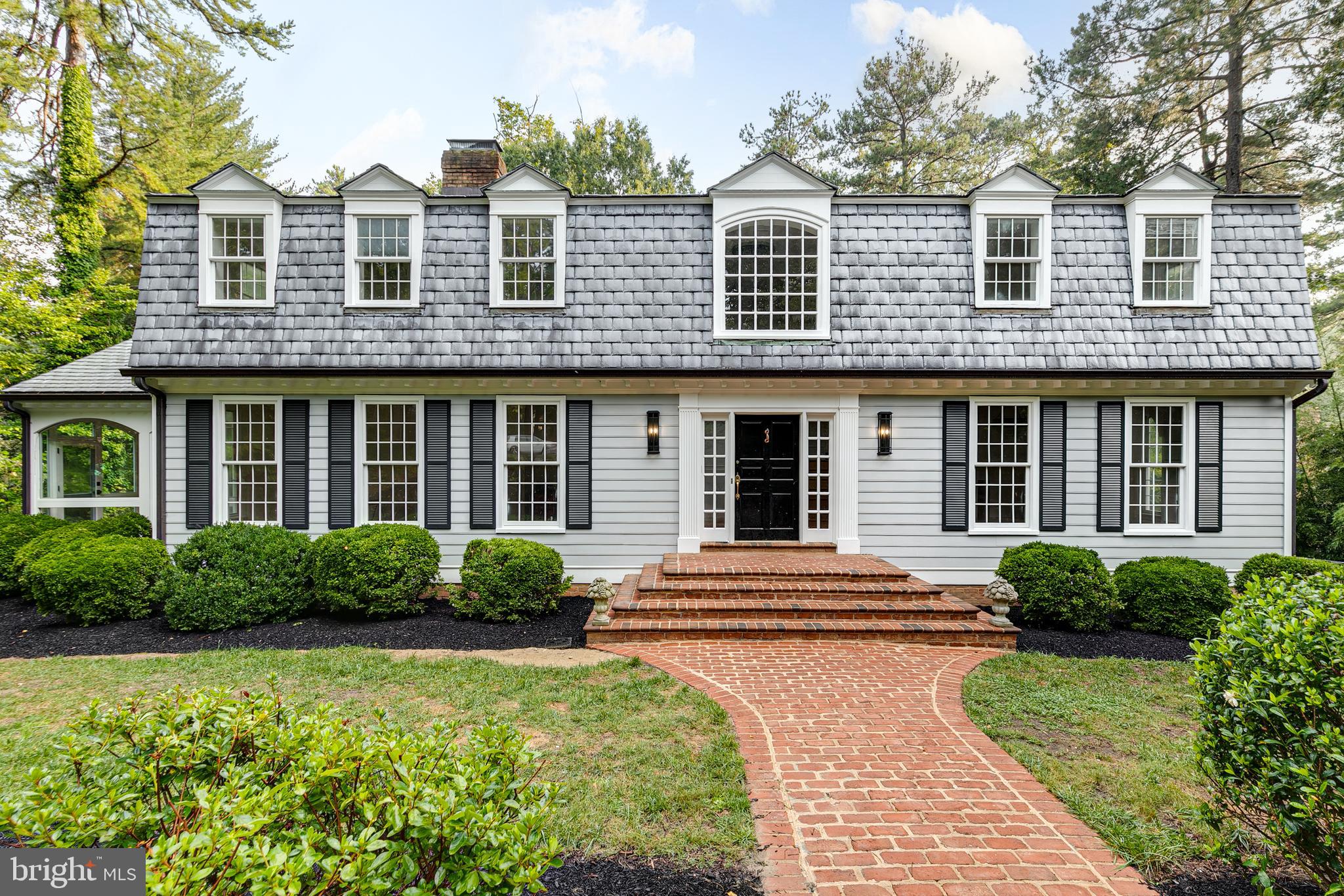 Nestled in the prestigious Sleepy Hollow neighborhood, this home offers breathtaking water views and direct lake access, spanning across three luxurious levels. As you step into the grand foyer, you'll be met by elegant and modern finishes that flow seamlessly throughout the home. The kitchen is chef's dream, complete with an incredible butler's pantry, and opens onto a newly constructed, screened-in & heated second-floor entertaining terrace. This indoor-outdoor living space, accessible via folding accordion glass doors, is the perfect spot for hosting gatherings all year in any weather, whether you're enjoying cocktails and lounging or dining by the water. The formal dining room sets the stage for entertaining, while the expansive living area and large breakfast room feature a cozy fireplace and endless sight-lines, allowing you to fully appreciate your property and its stunning views. The primary suite is a true sanctuary, with a private balcony with tranquil lake views—ideal for morning coffee or evening relaxation with a good book. Each bathroom in the home features beautiful tile work and custom finishes, adding a touch of luxury and style to every space. The full walk-out basement is a versatile area, complete with a custom bar, spacious living zone with lake views and abundant natural light, a potential bedroom, and a generous utility/storage section. With ample room for both relaxation and recreation, this waterfront haven is truly a dream come true. Schedule your private tour today and experience the elegance and serenity of lakefront living in Sleepy Hollow.