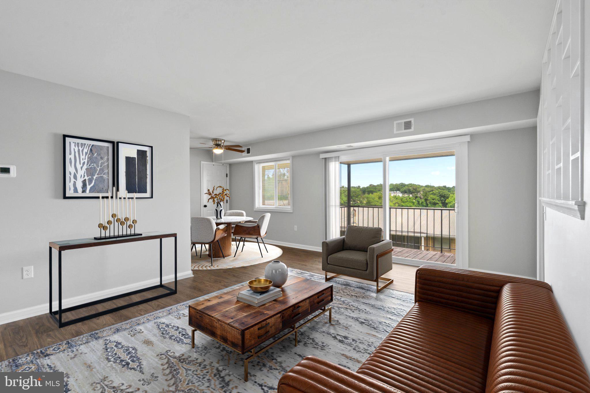 Welcome home to this beautifully renovated 2-bedroom, 1-bath garden-style condo offering the perfect blend of comfort, convenience, and connectivity. Filled with natural light, this bright and airy unit features sliding glass doors leading to a private balcony off the living room — ideal for relaxing or entertaining. The generously sized primary bedroom has an abundance of closet space for your convenience. The secondary bedroom, located on the opposite side of the unit for optimal privacy, is perfect for sleeping or as an office or guest room.

The galley style kitchen is fitted with brand new stainless steel appliances and a gas range. The white shaker style cabinets combined with the quartz countertops give the kitchen a bright, modern feel.

Parking is a breeze with a large lot just outside the building and two reserved parking passes included. Water is included in the condo fee for added value.

Perfectly situated for commuters, the property is steps from New Carrollton Metro, Amtrak, and MARC train stations, as well as the future Purple Line. Whether you're commuting to DC, Baltimore, the University of Maryland, or beyond -- this location offers exceptional transit access in every direction. Enjoy unmatched convenience with grocery stores, pharmacies, restaurants, and everyday essentials all just moments away.