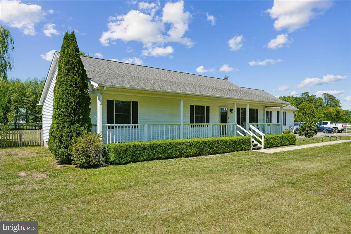 Welcome home to this charming rancher situated on a beautifully maintained 2-acre lot, offering the perfect blend of privacy, space, and comfort. This well-cared-for home features 3 bedrooms, 2 full bathrooms, and an attached oversized 2-car garage with plenty of room for vehicles, storage, or a workshop.

Enjoy outdoor living at its finest with a welcoming front porch, a spacious rear patio ideal for entertaining, and approximately 1.5 acres of fully fenced yard space—perfect for pets, gardening, recreation, or simply enjoying the peaceful surroundings. The flat, usable lot provides endless possibilities while maintaining a park-like setting.

Inside, you'll find comfortable one-level living with a functional floor plan and pride of ownership throughout. Whether you're looking for room to spread out, entertain guests, or enjoy the tranquility of country living with modern conveniences nearby, this property is a must-see.
