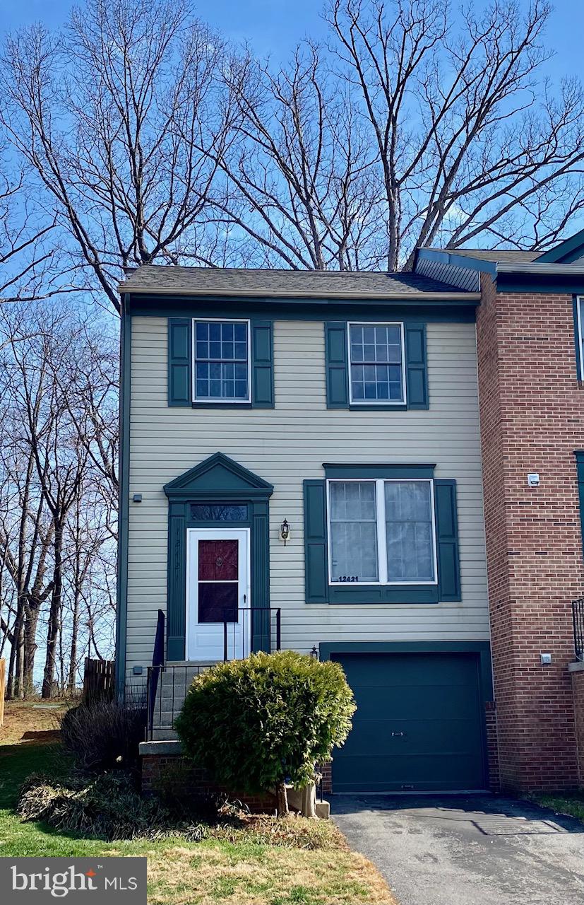 Charming end-unit townhouse in Germantown’s desirable North Lake Woods community! This move-in ready home features freshly painted interiors and exterior, new shutters, a resurfaced asphalt driveway, and a brand-new roof installed in February 2026 with a 30-year warranty. Luxury vinyl plank flooring runs throughout the home.

The bright main level offers a spacious living room with large windows, a convenient half bath, and a dining area that flows into an upgraded kitchen with stainless steel appliances—perfect for everyday living and entertaining. Enjoy outdoors living on the spacious deck with a fenced backyard overlooking trees, ideal for relaxing, gardening, or bird watching.

Upstairs features an owner’s suite with walk-in closet and updated full bath, plus two additional bedrooms and another upgraded full bath. The lower level includes a refreshed laundry room with storage, access to the one-car garage, additional storage closets, and a cozy family room with fireplace.

It is conveniently located just minutes from Gunners Lake, shopping, restaurants, parks, Route 270, and Germantown MARC Station.