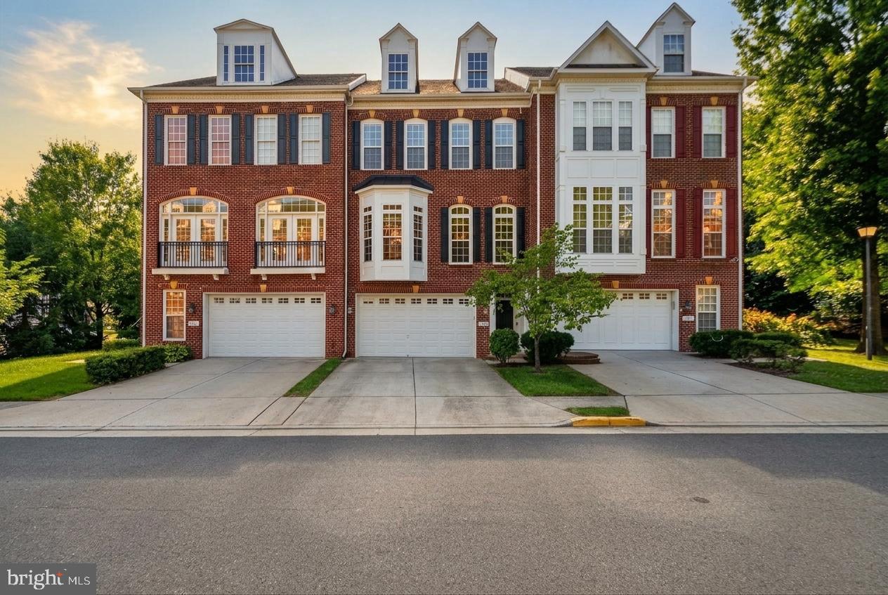 Welcome to 4370 Patriot Park Court—a stunning brick-front, three-level townhome offering 3 bedrooms, 3.5 baths, and a two-car garage in the heart of Fairfax. Located within the highly sought-after Oak View, Frost, and Woodson school pyramid, this exceptional home perfectly blends elegance, comfort, and convenience in an unbeatable location.

Step inside to a gleaming hardwood foyer that immediately sets the tone. Upstairs, the expansive main living level is truly the heart of the home. Rich hardwood flooring, soaring ceilings, and an abundance of windows fill the space with natural light, creating a warm and inviting atmosphere. The expansive gourmet kitchen is a showstopper, featuring granite countertops,  an electric fireplace, and generous space for dining, casual seating, or both. Designed for effortless entertaining and everyday living, the kitchen flows seamlessly into the spacious living room, elegant dining area, and a flexible bonus space ideal for a home office, reading nook, or play area. Step outside to the private deck overlooking peaceful tree-lined views—the perfect place to enjoy your morning coffee or unwind with a glass of wine at day's end.

The upper level is dedicated to comfort and relaxation. The expansive primary suite offers a cozy sitting area and a beautifully updated, spa-inspired bath complete with dual vanities, a luxurious jetted soaking tub, and a tiled walk-in shower. Two additional generously sized bedrooms, a second full bath, and a conveniently located laundry room complete the upper level.

The walk-out lower level provides exceptional flexibility with a spacious family/rec room, a third full bath, and large windows that flood the space with natural light. Whether you envision a recreation room, guest suite, home office, or fitness area, this versatile level easily adapts to your needs. Step outside to the private yard—an inviting outdoor retreat perfect for pets, playing, entertaining, grilling, or simply relaxing in a tranquil setting.

Nestled within a secluded, park-like community, yet just steps from the endless dining, shopping, and entertainment of Fairfax City, George Mason University, the Fairfax County Courthouse, parks, and commuter routes, this home offers the rare combination of luxury, privacy, and everyday convenience. This is Fairfax living at its finest.