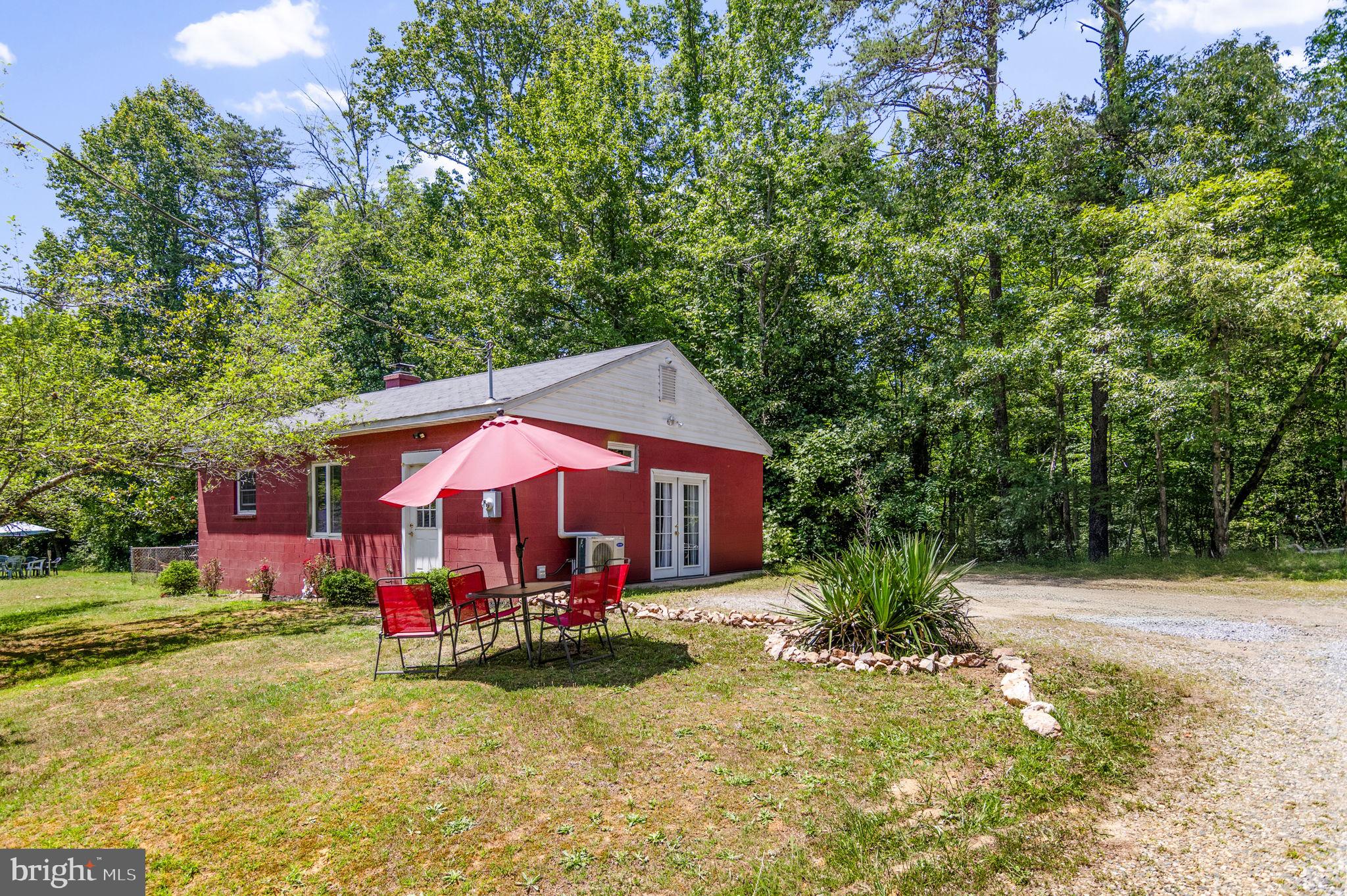 This Detached Efficiency/Studio sits on a 2 acre lot along with a main home that is occupied by the Landlord.  
The Dwelling can be completely furnished or tenant can bring own furniture.  The Living area includes a  custom Sofa, 2 side custom chairs, Coffee table with end tables and lamps. Also includes a large 50" TV.  The area designed as a bedroom area is separated by Beautiful folding room dividers, Queen Bed with Dresser and mirror, a hutch for storage and a separate closet. The Studio is decorated in Burgundy, Black and  some white and grey pieces if tenant wants it furnished.  The Kitchen area includes Electric stove, Microwave, Sink area and Full size Refrigerator. Large counter for storage and bar chairs for your eating area. The Bathroom has a single  sink, toilet and a shower only. NO BATHTUB! Studio has its own Electric with separate electrical meter from main home. Tenant is responsible for Electric Bill. Cable TV is paid for by Landlord but tenant pays for internet service. 
THE OWNER/LANDLORD WILL BE SHOWING PROPERTY AND IS HANDLING EVERYTHING IN REGARD TO GETTING THIS STUDIO RENTED. PLEASE CONTACT OWNER FOR SHOWINGS AND ANY OTHER INFORMATION .  AGENT JUST PLACED AN ENTRY INTO BRIGHT MLS FOR LANDLORD.