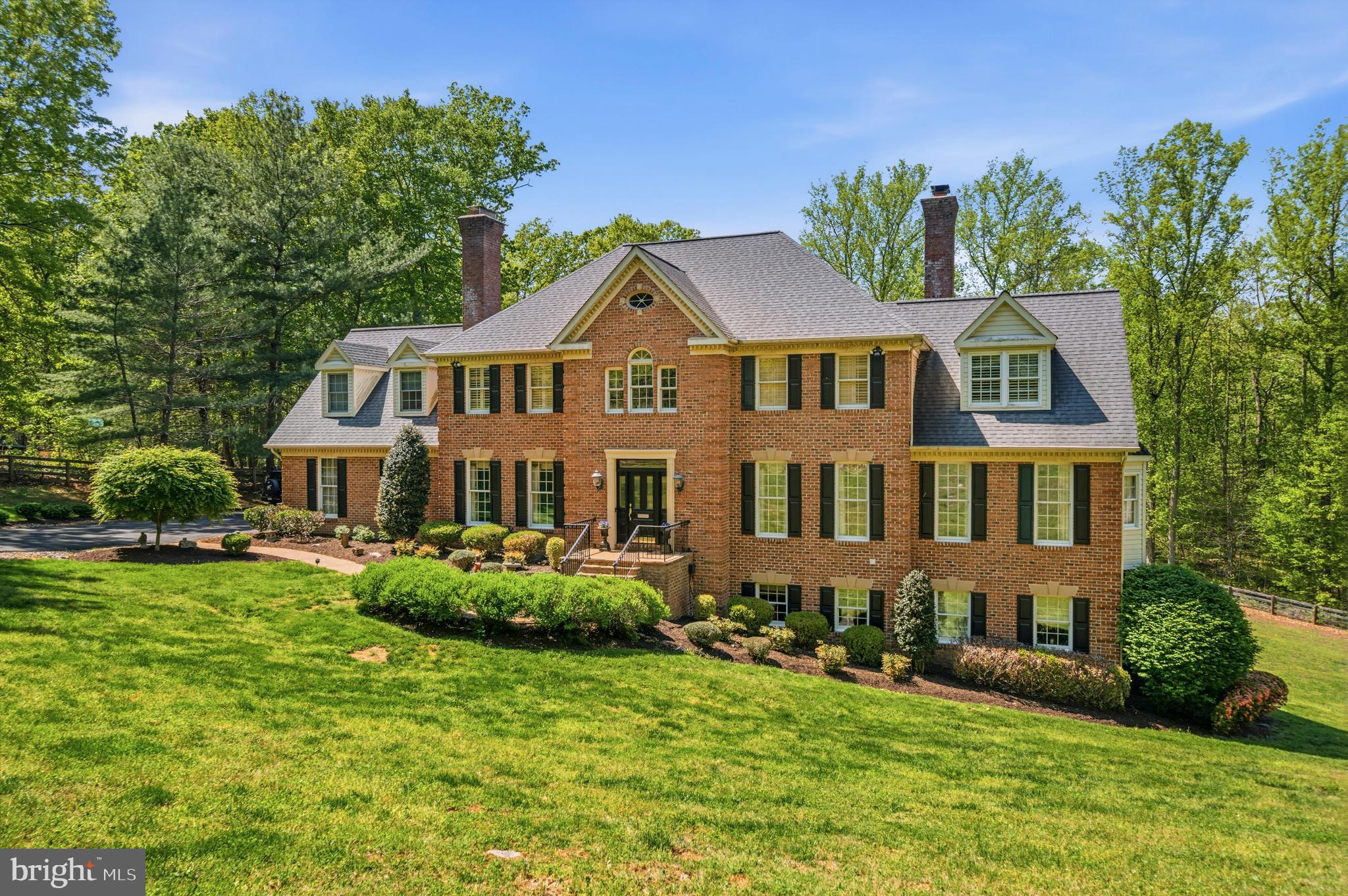 Welcome to this extraordinary luxury estate home nestled in the prestigious community of Westervelt.  Upon entry, a dramatic two-story foyer sets the tone for the elegance within. Intricate crown and wall moldings create a sophisticated ambiance, complemented by warm designer tones, and architectural details that evoke timeless Williamsburg-inspired charm.   A striking two-sided fireplace anchors the expansive gathering room and flows seamlessly into the light-filled conservatory sunroom, offering a unique and versatile living space ideal for both everyday living and grand entertaining. A stately main-level office provides the perfect setting for today’s work-from-home lifestyle.  Large Palladian windows and doors line the kitchen and the screened-in deck, which has skylights.  In every room, you'll discover built-in bookshelves, brick accents and windows dressed with plantation shutters and custom treatments.  

The spacious and lofty upper level landing elegantly connects four generously sized bedrooms.  A whimsical primary suite is complete with its own fireplace, an exceptional spa-inspired ensuite bath, and a custom, light-filled expanded dressing room with dormers.  All bathrooms throughout the home have been recently remodeled with timeless, classic finishes.

The well-appointed lower-level is designed for entertaining, featuring a expansive recreation room, stylish bar, two bedrooms, and a full bathroom.  The walk-out basement offers easy access to the resort-style backyard, which showcases stone walkways, lush landscaping, and a stunning in-ground pool, all surrounded by serene wooded views. Fully fenced and sitting adjacent to 100 acre farmland and conservation area, this remarkable estate offers grandeur and privacy within an exclusive enclave, yet remains conveniently close to major commuter routes, shopping centers, Wegmans, and Route 66 in Gainesville or Old Town Warrenton, both just minutes away.   This is a rare opportunity to enjoy refined living, natural beauty, and everyday convenience in one exceptional residence. Approximate age of systems & notable upgrades: **2015 Roof* HVAC 10-12 yrs old** New Heat Pump (6mo) **Water Heater/Septic and Well pumps under 10 yrs old**Long Fence 10 yrs Old**Garage Doors Replaced 5 yrs old**2023 Inground Pool and Landscaping**3 wood burning fireplaces with option for gas**Private Gated Entrance***