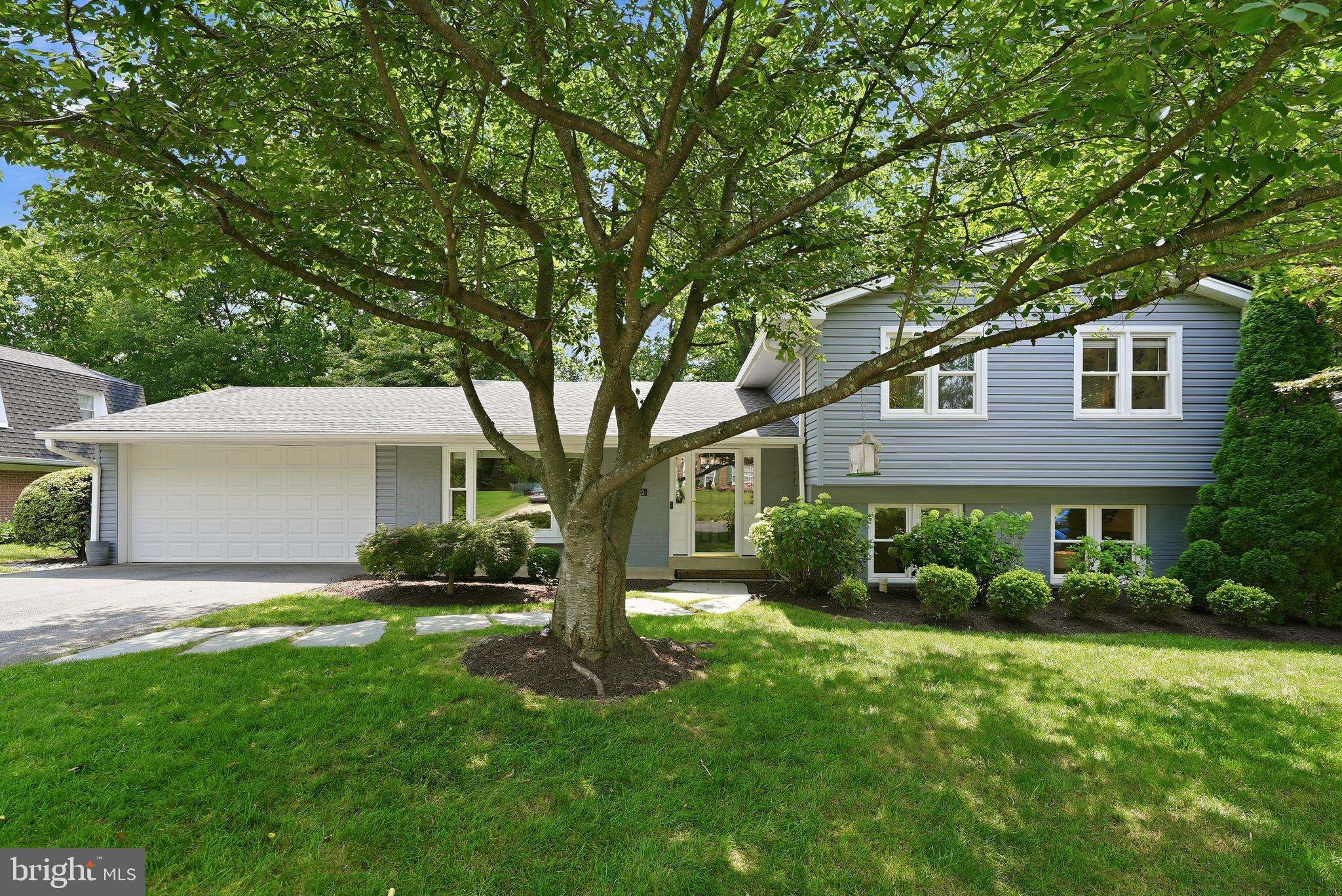 Tucked away on a quiet cul-de-sac in the heart of the Town of Vienna, this beautifully reimagined four-level residence seamlessly blends timeless character with thoughtful modern updates. Offering 5 bedrooms, over 3,000+ square feet, and a rare attached two-car garage, every space has been carefully designed to support the way we truly live today.

A picture-perfect first impression begins with a charming front porch framed by mature landscaping, vibrant hydrangeas, manicured boxwoods, and a stately dogwood that transforms the property each spring. Inside, a welcoming foyer unfolds into sun-filled living spaces where a classic yet open floor plan creates effortless flow between the formal living room, dining room, breakfast area, and beautifully newly renovated kitchen.

Designed to be both beautiful and functional, the kitchen is the heart of the home. Custom cabinetry, quartz countertops, stainless steel appliances, generous prep space, and striking Spanish terracotta tile flooring create a warm, inviting atmosphere that feels equally suited for everyday mornings and memorable gatherings. Just beyond the dining room, the expansive screened porch extends the living space outdoors with skylights overhead and a mounted television ready for football Sundays, movie nights, or quiet evenings overlooking the private backyard surrounded by mature trees and lush landscaping.

Upstairs, the primary suite serves as a peaceful retreat filled with natural light. The fully renovated spa-inspired bath features heated marble floors, a dual vanity with marble countertops, and a frameless oversized glass shower. Three additional bedrooms, another beautifully renovated full bath, and ample linen storage complete the home’s private living quarters.

The lower level offers exceptional flexibility with a spacious family room anchored by a gas fireplace with brick surround and a wall of windows that fills the space with natural light, something uncommon to find in lower level spaces. A custom built-in library creates the perfect home office, reading room, or private guest bedroom, while the oversized laundry and mudroom features a utility sink, abundant storage, and a separate exterior entrance ideal after gardening, yard work, or outdoor adventures.

One of the home’s most unexpected highlights awaits beyond the lower level: a dedicated theater and game room designed for entertaining or simply just enjoying. Complete with a projector, surround sound, and a large sectional that conveys, this is the ultimate destination for movie nights, game days, and creating lasting memories forever.

Extensively improved over the years, the home offers the confidence of significant capital investments, including a renovated kitchen and bathrooms, screened porch addition, study addition, roof and gutters, exterior siding and paint, upgraded water heater with integrated dehumidifier, new water service line, recessed lighting, enclosed garage conversion, and numerous additional enhancements throughout.

Living in the Town of Vienna means more than owning a beautiful home. It means enjoying one of Northern Virginia’s most beloved communities, where parks, local restaurants, boutique shopping, farmers markets, community events, and the W&OD Trail are all not only moments away, but walkable. Zoned for the highly acclaimed, nationally ranked Madison High School pyramid and offering easy access to the Vienna Metro, Tysons, Reston, Arlington, Washington, D.C., Wolf Trap, major commuter routes, and two international airports, this exceptional residence delivers the perfect balance of neighborhood charm, everyday convenience, and timeless appeal.
