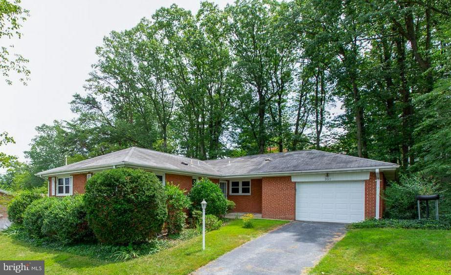 Opportunity! 3 Bedroom/3 Full Bath solid brick rambler with  2400+ finished sq ft and oversized attached garage.  Close to downtown Silver Spring, DC, White Oak, FDA. Minutes to 495.  Two fireplaces, hardwood floors, separate dining room, two full bathrooms on main level, eat-in kitchen.  Separate entrance and full bath on finished lower level that features a wood burning fireplace. Home has been meticulously cared for. Furnace replaced in 2010, water heater in 2011.  Enjoy the enclosed porch with walls of windows as you gaze upon the lush backyard. Appraised above list! Montgomery County schools. Open Sunday, Aug 18 from 2-4.
