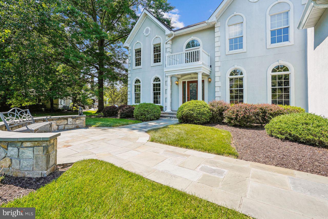 Welcome to your dream home set at the top of a meticulously groomed .83-acre in Oakton Chase within the Oakton High School Pyramid! This stunning 4-bedroom, 4.5-bathroom residence boasts luxurious modern living spaces and amenities, making it an ideal sanctuary for discerning buyers with a sharp eye for interior design.

Step into elegance as you enter the foyer, greeted by an abundance of natural light that illuminates the entire home. The main level features a bright and airy kitchen, perfect for culinary enthusiasts, complete with updated appliances, two large islands, ample storage, and sleek white quartz countertops. Whether you're hosting intimate gatherings or entertaining guests, this kitchen is sure to impress. Rich engineered hardwood floors take you on your tour through the entire 6,600 square-foot home with high ceilings, a gas-log fireplace, from the kitchen to a screen-in back porch, and out to a hardscape rear patio. The 3-car side-load garage provides comfortable accessibility for everyday use and storage.

Indulge in relaxation in the updated bathrooms, where spa-like amenities and contemporary finishes create a tranquil retreat. With four spacious bedrooms, including a lavish primary suite featuring radiant heat in the bathroom floor, a deep soaking tub, and an enormous walk-in closet. 

The fully finished and remodeled basement adds an additional dimension to this already impressive home. Ideal for movie nights, game days, or simply lounging, this versatile space offers endless possibilities for recreation, entertainment, and storage.

Outside, enjoy the serenity of your private oasis, surrounded by lush landscaping, mature trees, and ample hardscaping with a built-in gas grill. Whether you're sipping your morning coffee on the expansive patio or hosting summer barbecues in the tree-lined backyard, outdoor living has never been more inviting.

Convenient to all the DC Metro Area, located in the highly regarded Oakton Chase, this home offers the perfect blend of privacy and accessibility. With easy access to shopping, dining, and two international airports (Dulles and Reagan), you'll enjoy the best of your world.

Don't miss your chance to own this exceptional property. Schedule a showing today and experience luxury living at its finest!