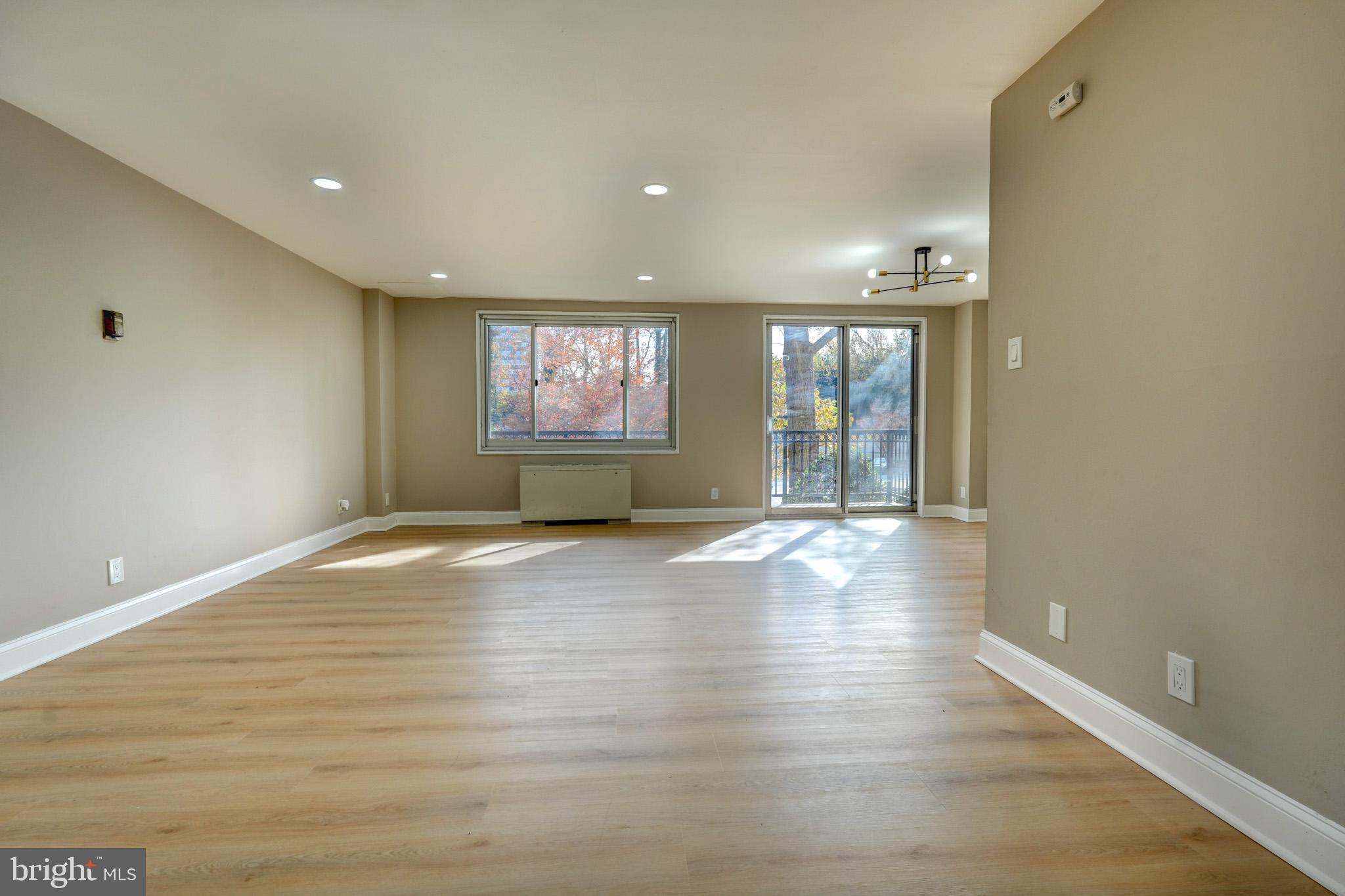 HUGE PRICE DROP!!!Location, location, location. This largest floor-plan unit is completely renovated. This amazing condo is located in a quiet neighborhood with a lot of amenities around. When you park in your reserved garage spot you can gain access to the building right across the hall from your beautiful home. Talk about ease of loading and unloading your groceries! Once inside you will have plenty of space to make this place feel like home. Enjoy your remodeled kitchen with Granite counter-tops and Reico cabinets. Your updated bathroom is perfect. All new Luxury Vinyl Flooring is amazing. Plenty of storage in both the bedroom closets and the walk-in closet that are equipped with Alpha Organization Systems. When you are ready to step outside for some fresh air then do so with ease as you walk onto your private balcony. Large enough for outdoor seating and plant life if you choose. Surrounded by beautiful trees as well gives you even more sense of privacy. The building itself has a staffed front desk, large swimming pool with grill access, party room, and now open rooftop deck! Right outside you will have access to Metro, which includes the new purple line. Hop on the Capital Crescent trail if you wish and enjoy all of the great outdoors. Easy access to DC, 495, and Downtown Silver Spring. Location is everything and you can have everything here!