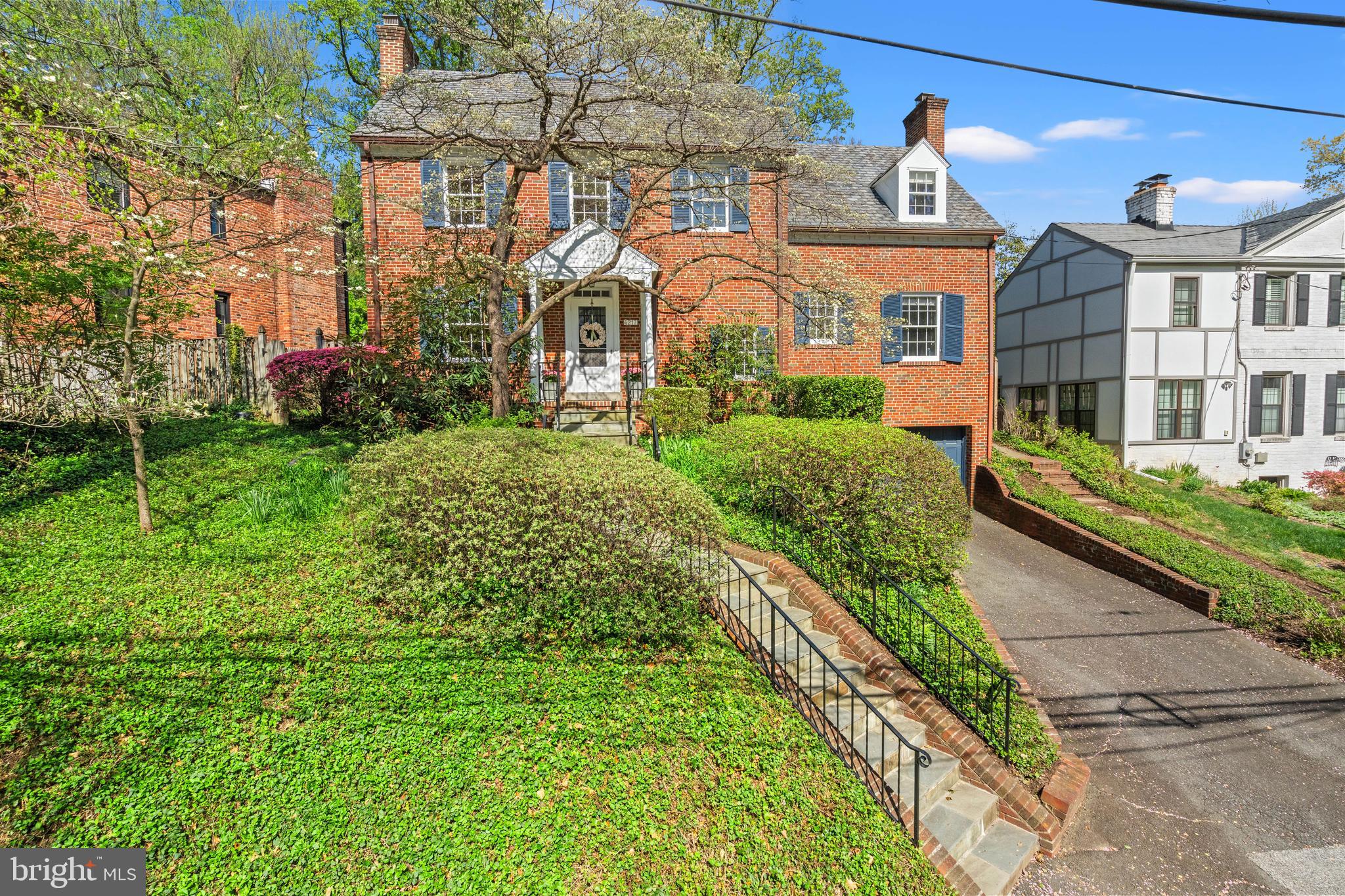 Great Scale, and Generous Room Sizes. Classic all-brick home with driveway and two-car garage, set on a beautiful large private lot with a wide backyard framed by mature landscaping. Inside, you will find solid hardwood floors, three fireplaces, and gracious room sizes throughout. The main level offers a welcoming living room with fireplace that opens to a sunporch with wood floors and out to the backyard. An oversized dining room with views of the lush yard features two built-in corner cabinets and connects to the kitchen, also providing access to the backyard. A powder room is located off the main hall. A private office or den tucked away at the end of the hall features a wet bar and fireplace, providing excellent work-from-home or flex space.

Upstairs, two secondary bedrooms share a full bath. The primary bedroom is served by a hall bath featuring an oversized tub, with an easy opportunity to renovate and expand into a true primary suite if desired. A walk-up attic offers a fourth bedroom with hardwood floors and charming built-ins, ideal for guests or additional workspace.

The finished lower level includes a recreation room with fireplace and new luxury vinyl plank flooring, a laundry room, and direct access to the two-car garage.

With a traditional slate roof, a new furnace (2025), and timeless construction, this home offers outstanding bones and incredible potential. The kitchen and baths are ready for updates, providing a wonderful opportunity to customize and create your dream home.

Ideally located in the Town of Chevy Chase with excellent walkability to downtown Bethesda, the Metro, Jane E. Lawton Community Recreation Center, and local schools.