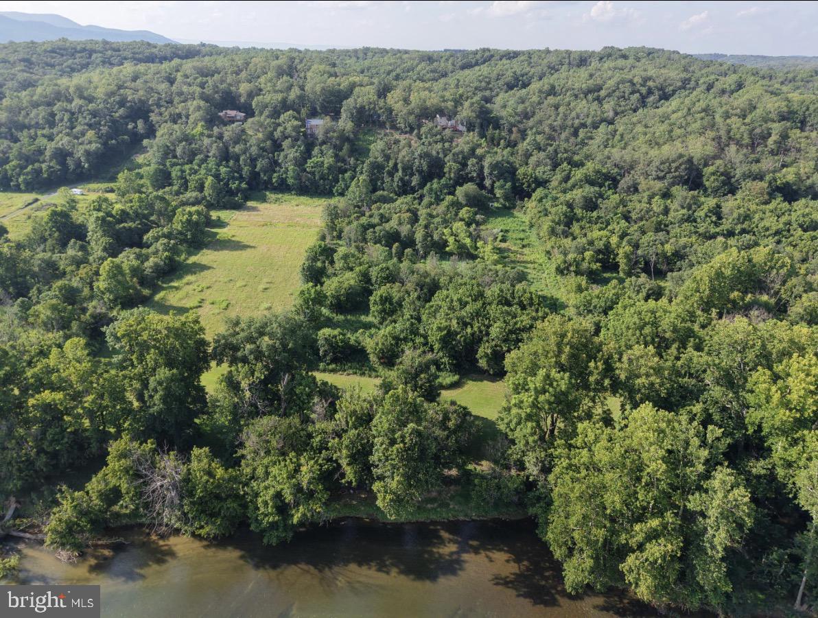 Come see this wonderful 5 acre riverfront lot in Poca Bella Farms!  170 feet of gorgeous river frontage and beautiful Mountain Views!  Previously Perked for 3 bedrooms.  We have house plans and we have builders available!  Located within walking distance of Reitano Winery and a short drive to restaurants, shopping, and Skyline Drive Skyline Caverns, & Shenandoah River Park.  Can you imagine, your own private riverfront paradise?!!