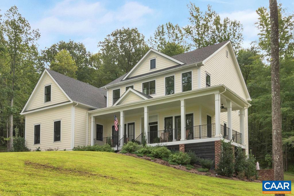 Privacy awaits just atop your secluded driveway at the end of a cul-de-sac.  The elevated building site is surrounded by trees and this lot is bracketed by two large tracts that are not dividable.   Relax in the peaceful tranquility of nature while still being just a 15 minute drive to Charlottesville.   The Woodbridge is a spacious traditional 2-story that features a large great room, open kitchen, breakfast nook, and formal dining room, along with a study, bedroom, and full bath on the main floor.  This floor plan makes great use of indoor/outdoor living with front and rear porch spaces.  The four-car garage provides great storage and utility.  Finishes will vary from photos shown.  Selections can be made with builder design center allowances.,Granite Counter,Wood Cabinets,Fireplace in Great Room