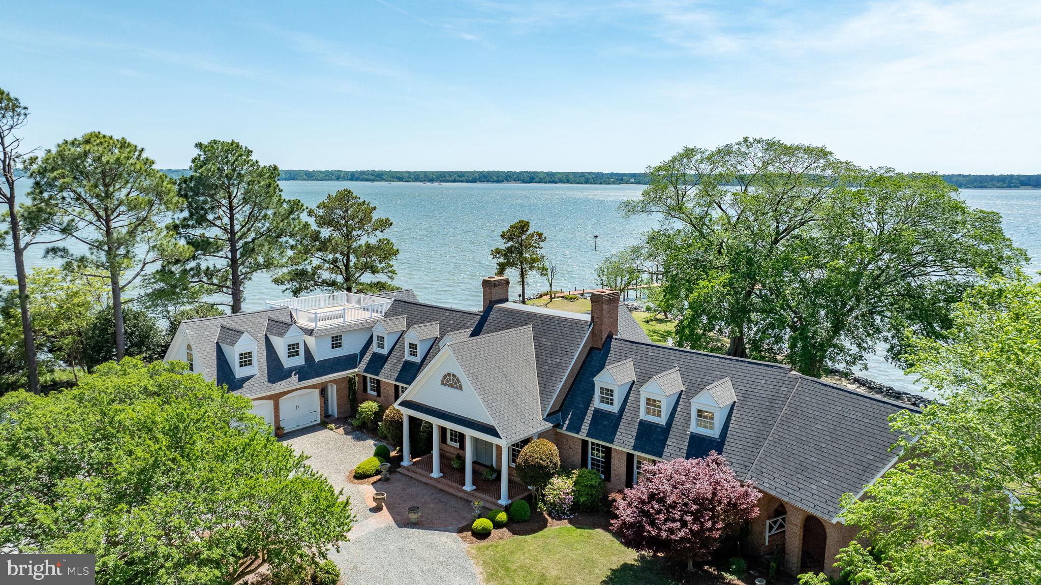 A once-in-a-lifetime opportunity to own one of the only private island residences on the East Coast. Carmines Island, nestled on the York River, offers the very picture of refined southern serenity with this gracious estate. Panoramic water views from every single room and acres of timeless landscape. Every inch of this home is steeped in old world charm from the grand colonial hearth in the dining room, to the chef's kitchen with luxury appliances, to the rich wood and marble finishes in the primary suite, complete with its own balcony. End the day on your private pier, enjoying the best fishing and crabbing in Virginia. Minutes from everything Gloucester has to offer..but a world away. Here, peace isn't a promise...it's a way of life.