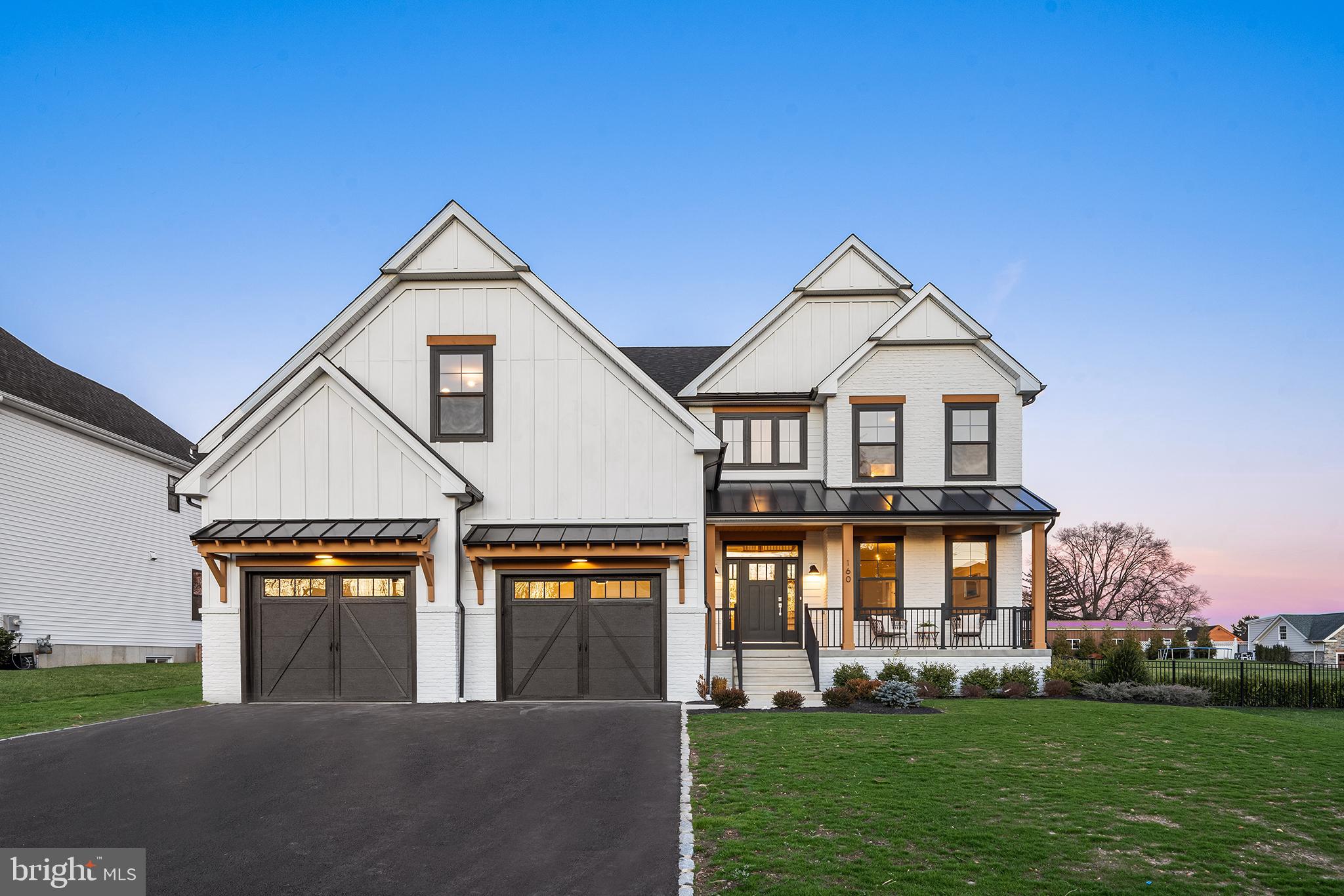 A brand-new luxury construction home unveils a seamless blend of modern sophistication and rustic farmhouse charm. Spanning a generous layout of 4 bedrooms and 3 full baths/2 half baths, a finished basement and 2 fireplaces. The eye-catching facade captivates with a harmonious blend of rustic wood, sleek standing seam roof, and classic painted white brick. These elements whisper promises of the contemporary farmhouse elegance that unfolds within. Step inside onto the sumptuous hardwood flooring that flows consistently throughout, reflecting the home's cohesive blend of luxury and warmth. The expansive foyer, lit by the soft glow of natural light, introduces the spacious open-concept living areas, where meticulous craftsmanship meets comfort. The kitchen stands as the heart of this masterpiece, boasting pristine quartz countertops that shimmer against the soft lighting. It's fully equipped with top-tier stainless steel appliances, including a double oven, stove top, microwave drawer and dishwasher, offering the perfect environment for culinary brilliance. A generous island, ideal for casual breakfasts, heartfelt conversations, or evening wine tastings. Adjacent to the kitchen, the living and dining spaces provide a harmonious transition, with vast floor-to-ceiling windows framing picturesque views and bathing the interiors in a serene ambiance. A formal dining room is assisted by a butler's pantry and walk-in pantry. Family entrance from the garage enters a mudroom with custom benches and cubbies with a tucked away powder room. Ascend the curved staircase to the find the Primary Bedroom, a sanctuary in its own right, featuring hardwood floors, an accent wall, huge walk-in closet and luxury finishes. The ensuite evokes sheer opulence with its spa-inspired bathroom, showcasing a rain shower, exquisite tile, a dual vanity set and high-end fixtures. Bedroom 2 is a retreat of its own with a walk-in closet and 3 piece ensuite showcasing the tiled shower. Your journey continues as you descend into the finished basement, a canvas of possibilities against the backdrop of a linear fireplace and includes a half bathroom.. Use this space to create your state-of-the-art home theater, a personal gym, or an entertainment hub, this space stands ready to adapt to your vision. An oversized two car garage, covered patio and large level yard finish this spectacular home. This modern farmhouse ensures a balance of serenity while being a stone's throw from upscale dining, premium shopping hubs, and scenic nature trails. With swift access to main arteries and city conveniences, you'll find that this home offers both retreat and connectivity.