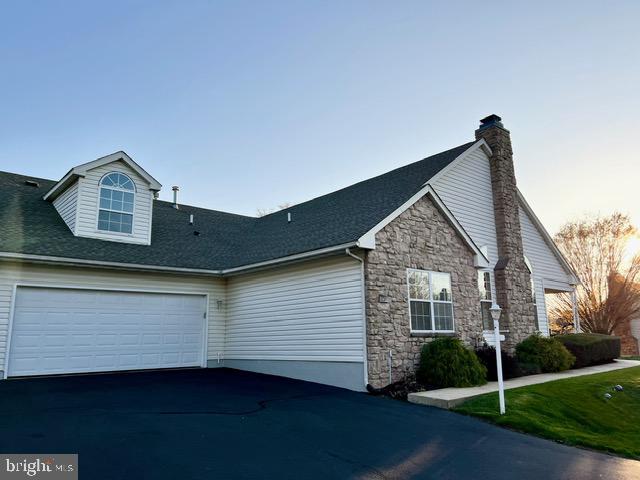 This meticulously maintained townhouse is pristine and move-in ready. Recently updated with fresh paint and brand-new carpeting throughout, this home is located in the highly sought-after 55+ community of Lionsgate. Residents enjoy a wealth of amenities, including a swimming pool, tennis/pickleball courts, a fitness center, and a clubhouse. Upon arrival, choose between entering through the front door or pulling your car into the oversized attached two-car garage, where you can access a private entry leading directly to the laundry room and kitchen. The kitchen boasts generous counter space and cabinetry, flowing effortlessly into the bright and inviting living area. The great room features vaulted ceilings, expansive windows, and a cozy gas fireplace. Glass sliders open to a private front patio, providing an ideal space for outdoor relaxation.  Glass French doors lead to a den perfect for a study/office or an additional living room.
The spacious primary bedroom offers a tranquil retreat with an en-suite bathroom including glass shower and a large walk-in closet. The second bedroom includes its own private bath with a tub-shower combo, ensuring comfort and convenience for guests. Upstairs, a versatile loft space awaits, perfect as a bedroom, home office, or crafting room.  The loft closet offers even more storage and the potential to be easily converted into a half bath.  The low maintenance exterior includes newer roof (2021) and gutter heaters. This home is ideal for anyone seeking an affordable, well-maintained residence in a vibrant active adult community.