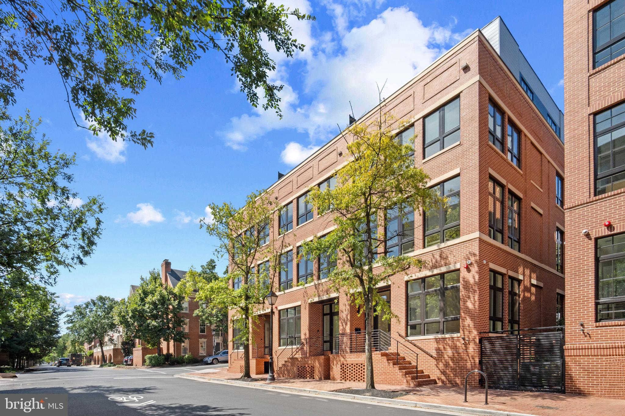 Situated on Old Town Alexandria’s most prestigious street, this River Row Elevator Residence at 223 South Union Street is the last available home of the six newly constructed, LEED Gold-certified homes redefining luxury living along the Potomac River. Developed by the visionary JC Development, this four-level residence offers a rare fusion of refined design, advanced engineering, and an unbeatable waterfront location—with no HOA or condo fees. Crafted from solid steel and concrete and wrapped in classic brick, the residence spans 3,366 square feet and rises four stories via a private elevator.  Architectural integrity is evident throughout with 12-foot ceilings, 9-foot solid core doors, 8.5-inch white oak flooring, and expansive Andersen windows create a light-filled, contemporary interior grounded in timeless materials. The main living level features an open-concept layout flowing to a 440-square-foot outdoor terrace finished in imported Spanish porcelain tile—ideal for entertaining or alfresco dining. The gourmet kitchen is appointed with soft-close American Woodmark cabinetry, Taj Mahal quartzite countertops, and a professional-grade appliance suite: Thermador 36-inch gas range, double electric wall ovens, Bosch French-door refrigerator, Thermador dishwasher, and Sharp microwave drawer. Every detail is designed for elevated daily living and seamless entertaining. Four spacious bedrooms—each with ensuite marble-clad baths and Kohler fixtures—offer comfort and privacy. The top level opens to a 189-square-foot rooftop terrace with city and river views in select homes, enhanced by a fourth-level wet bar featuring Taj Mahal quartzite counters and a Summit beverage refrigerator. LEED Gold certification reflects the residence’s commitment to sustainability and efficiency. High-performance systems include recessed LED lighting, 2-zone Goodman HVAC with Ecobee smart thermostats, electronic air filtration, humidifiers, a Rinnai tankless water heater, and a full home sprinkler system—resulting in lower utility costs and superior indoor air quality. Additional highlights include an 800 lb-capacity private elevator, integrated surround sound, Akuvox smart doorbell, multiple laundry hookups, and a lower-level family room with a second wet bar, Taj Mahal quartzite counter, and dual-zone Newair beverage refrigerator—ideal for casual gatherings or movie nights. The oversized two-car garage (21’ x 20’) includes a low-profile door for enhanced headroom and a Kwikset keypad entry for added convenience. Each residence comes with a California Closets credit for customized wardrobe systems. This is a rare opportunity to own newly built luxury on one of Old Town’s most iconic blocks—just one block from King Street and steps from the Potomac River and waterfront promenade. With over 20 dining options within three blocks, four parks within six, and proximity to Lyles-Crouch Elementary School, River Row supports an effortless, enriched lifestyle.
Commuters enjoy quick access to Reagan National Airport (3.7 miles), King Street Metro and Amtrak/VRE Station (1 mile), and key routes to Washington, D.C. and National Landing. Developed by JC Development—an esteemed firm with 25+ distinguished projects across the region—River Row is a testament to modern luxury grounded in Alexandria’s historic charm. Residence 223 is more than a home—it’s a landmark of thoughtful design, sustainable living, and timeless elegance.