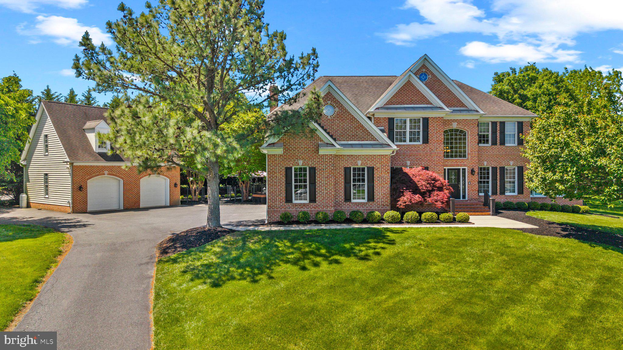Nestled in the serene enclave of Churchville Meadows, this exquisite Colonial home offers a luxurious lifestyle on a sprawling 2.64-acre lot, perfectly situated at the end of a peaceful cul-de-sac. The brick front exterior exudes timeless elegance, while the meticulously landscaped grounds invite you to explore the beauty of nature. Step inside to discover a harmonious blend of comfort and sophistication. The open floor plan is accentuated by gleaming wood floors and crown moldings, creating an inviting atmosphere throughout. The gourmet kitchen is a chef's dream, featuring a spacious island, pantry, and high-end appliances, including a wall oven and cooktop. The adjoining living area, complete with a cozy fireplace, is perfect for gatherings or quiet evenings at home. Retreat to the luxurious primary suite, boasting a walk-in closet and a spa-like bathroom with a walk-in shower. Each additional bedroom offers ample space and comfort, complemented by well-appointed bathrooms. Entertainment options abound with a fully finished basement, a personal heated pool, and a relaxing hot tub. The outdoor gazebo provides a charming spot for quiet reflection. With a total of five garage spaces and generous driveway parking, convenience is at your fingertips. This home is not just a residence; it's a lifestyle of elegance, comfort, and tranquility. Experience the perfect blend of luxury and warmth in this exceptional property.