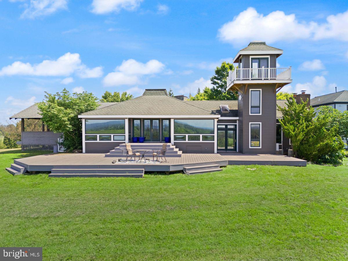 Welcome to 15192 Harrison Hill Lane, an extraordinary estate nestled on over 15 scenic acres in the heart of Leesburg, Virginia. This unique property features four distinct residences, offering unmatched potential for multigenerational living, income producing opportunities, or simply just a private oasis.

The Main Residence
Perched at the highest point of the property, the main home captures panoramic views of the Leesburg countryside. This 4 bedroom, 2.5 bath home features an open concept kitchen and dining area ideal for entertaining, and a unique watchtower that adds charm and functionality. Currently operating as a successful short term rental, it blends everyday comfort with strong income potential.

The Stone Tower
A striking work of 3 level European inspired architecture, this second residence showcases masterful stone craftsmanship with 20% quartz reinforced exterior walls and Category 4 storm rated windows. The mechanical, electrical, and plumbing (MEP) systems have already been roughed in, leaving this architectural gem just awaiting the final touches from its next visionary owner to complete a true masterpiece. Adjacent to the structure is a custom dug, nearly 18-foot-deep unfinished pool that could be finished or transformed into an underground event space or luxury retreat. In addition there's a designated spa area and completed stone gazebo with an outdoor fireplace offer elegant spaces for entertaining or peaceful relaxation.

The Barndominium Home
This modern two level residence features 2 bedrooms, 2.5 bathrooms, a spacious open concept main level ideal for entertaining, and its own scenic watchtower. The home also includes a large hangar, offering unique functionality for storage or creative use. Located beside three professionally lit pickleball courts, this home blends luxury living with exceptional recreational amenities.

The Guest Duplex
The fourth structure is a fully equipped, two level residence with independent apartment units on each floor, ideal for guests, extended family, or added rental income.

Just minutes from historic downtown Leesburg, award winning wineries, equestrian trails, and major commuter routes, this unique property offers exceptional lifestyle flexibility in one of Northern Virginia’s most sought after locations.

Don’t miss this rare opportunity to own a unique estate offering limitless potential, whether for personal enjoyment, multigenerational living, or income producing ventures, all within minutes of downtown Leesburg. Schedule your private tour today and experience the unmatched lifestyle that 15192 Harrison Hill Lane has to offer.