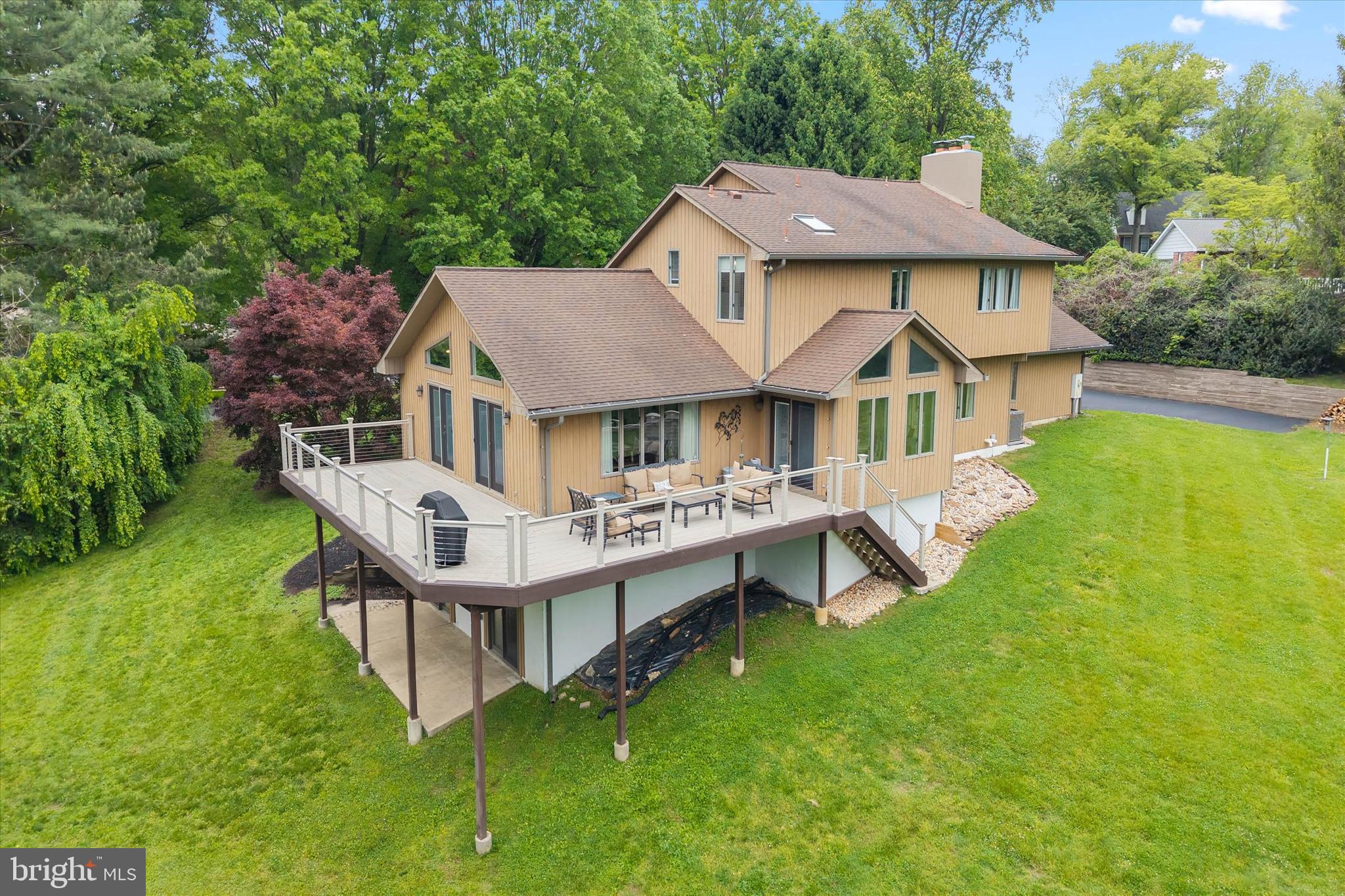 Welcome to 43 Bridleshire Rd., located in the highly desirable North Star area and nestled within the prestigious community of Bridleshire Farms. This magnificent custom-built home offers the perfect blend of luxury, comfort, and tranquility, all set against the backdrop of your own private pond and breathtaking natural views.
Designed with an open and airy floor plan, this exceptional home showcases soaring cathedral ceilings, oversized windows, and skylights that fill the interior with abundant natural light. The beautifully updated kitchen is the centerpiece of the home, featuring gleaming granite countertops, a fantastic center island, and stainless steel appliances — ideal for both everyday living and entertaining. Extensive updates throughout include the kitchen, the luxurious primary bathroom, and much of the flooring, creating a truly move-in-ready experience. Warm and inviting living spaces are highlighted by two wood-burning fireplaces — one located in the spacious family room and another in the serene primary bedroom retreat.
The upper level features three generously sized bedrooms, a full hall bath, and the stunning primary suite with its beautifully updated en-suite bathroom. The main level  not only includes most of the living space but an additional bedroom perfect for guests, an in-law suite, or a private home office, along with a full bath and convenient half bath.
The lower level adds approximately 1,000 square feet of finished living space and includes a luxury pool table area, providing endless possibilities for recreation and entertaining.
Step outside onto the maintenance-free wraparound deck and enjoy panoramic 180-degree views overlooking your own peaceful pond — a truly tranquil setting rarely found. Combining privacy, elegance, and an unbeatable location in one of the area’s most phenomenal neighborhoods, this extraordinary property is a rare opportunity to own a one-of-a-kind home in Bridleshire Farms.  NEW HVAC 2023 & New ROOF 2026! MOTIVATED SELLER!!!