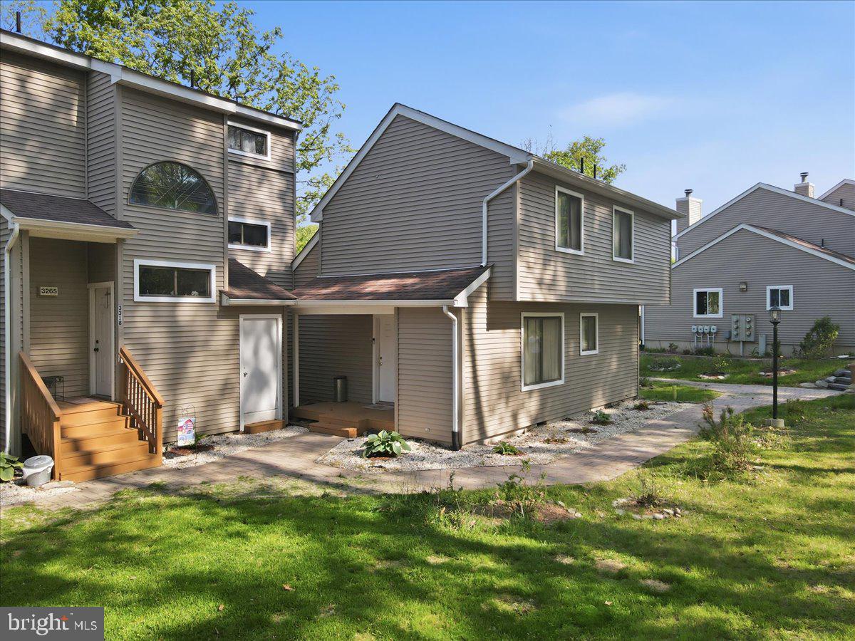 This end-unit townhome in the Mill Pond section of Saw Creek Estates presents an opportunity to own an income-producing property with exterior maintenance handled by the HOA. The tenant-occupied property features 2 bedrooms and 2 full bathrooms. The HOA covers roof, siding, and deck maintenance, eliminating exterior upkeep responsibilities. The living room includes a wood-burning fireplace, and the rear deck offers outdoor space to enjoy the surrounding setting. The home is equipped with forced air heat and central A/C and is just a short walk to lake access, a playground, and a community recreation center with a swimming pool. Amenities within Saw Creek Estates include 24-hour gated security, a restaurant, indoor and outdoor pools, a fitness center, a ski slope, lakes, tennis courts, and clubhouse facilities. Lease requires a minimum 90-day notice