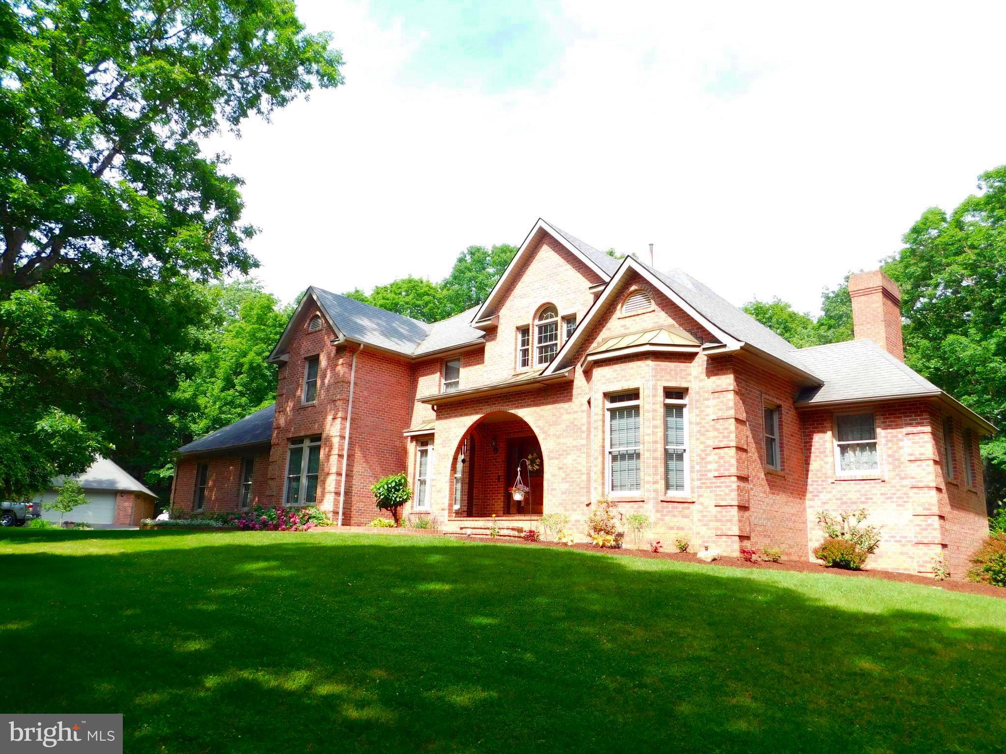 IF YOU’RE LOOKING FOR A PLACE TO CALL HOME, BUT ONE WITH NUMEROUS AMENITIES TO MAKE LIFE AS COMFORTABLE AS POSSIBLE. STUNNING 4.09 ACRE SHOWPLACE WITH LUSH GREEN LAWNS, SHADE TREES AND STREAM IS LOCATED IN A PRIME UPSCALE RESIDENTIAL AREA WITHIN 10 MINUTES OF DOWNTOWN KEYSER. MAGNIFICENT 14 ROOM, TWO-STORY (TOTAL BRICK) GEORGIAN MANOR CONTAINS 6,000 SQ. FT. OF LIVING SPACE DISTRIBUTED OVER 3 SEPARATE LEVELS. SPECIALLY DESIGNED FOR EXECUTIVE LIVING AND ENTERTAINING, THE LOWER LEVEL FEATURES A FULL FINISHED BASEMENT W CUSTOM TONGUE & GROOVE CHERRY, OAK & WALNUT PANELING, AN EXPANSIVE WET BAR WITH THE FINEST FIXTURES, “THEATER” ROOM, GAS LOG FIREPLACE & FULL BATH W/SAUNA. UPSTAIRS  GRAND MAIN ENTRANCE W OAK STAIRWAY, MARBLE TILE FLOOR AND FORMAL DINING & LIVING ROOM, BRICK FIREPLACE, PICTURE-FRAME SOLID CHERRY PANELED DEN WITH GALLERY BOOKCASES AND A COMPLETE CUSTOMIZED GOURMET KITCHEN WITH ALL NEW APPLIANCES INCLUDED, BREAKFAST AREA AND CERAMIC TILE FLOORING.  DESERVING MUCH ATTENTION, THE POSH MASTER BEDROOM SUITE FEATURES A MARBLE (REMOTE) GAS LOG FIREPLACE, TONGUE & GROOVE OAK PANELED WALLS, A LARGE LUXURIOUS FULL BATH, 14’X14’ DRESSING COMPLEX  (WALK-IN CLOSET) WITH  CERAMIC  TILE FLOOR, JACUZZI AND  WALK-IN CERAMIC TILE SHOWER UNIT.  FOUR ADDITIONAL BEDROOMS, WALK-IN CLOSETS AND 3½ BATHS COMPLETE THE LIVING AREA IN THIS GRAND HOME.  CERTAIN OTHER ESTATE FEATURES INCLUDE A PAVED DRIVEWAY W/ LIGHTED ENTRANCE PILLARS, 2 CAR ATTACHED GARAGE AND 2 CAR DETACHED GARAGE, PLUS BRAND NEW 35 YR. ROOF & "LEAF FILTER" GUTTER PROTECTION!! MANY MORE AMENITIES TOO NUMEROUS TO LIST.  CALL FOR MORE DETAILS AND APPOINTMENT.