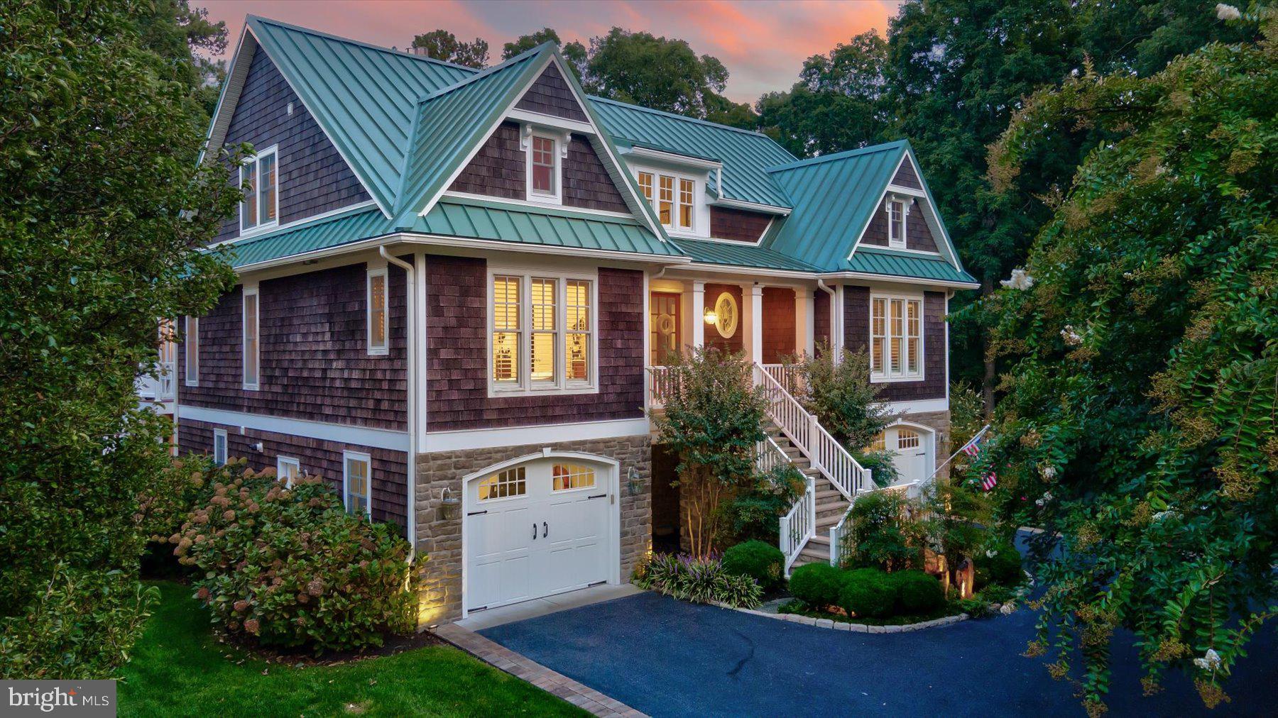 Rare to Market – Custom Waterfront Oasis in Rehoboth Beach.

Nestled along the picturesque shores of Canal Corkran, this exquisite 4-bedroom, 4.5-bathroom waterfront masterpiece epitomizes luxurious water’s-edge living. Meticulously crafted by the area's premier custom home builder, Garrison Homes, with the finest materials and attention to detail, this 4,760 sq. ft., three-level custom home showcases tranquil water views from nearly every room.

As you step inside, you are greeted by the perfect blend of traditional elegance and modern coastal chic. Crisp white and neutral tones, plantation shutters, and French doors create a light-filled, airy atmosphere, complemented by rich hardwood floors, soaring ceilings, crown molding, and recessed lighting throughout. Cozy gas fireplaces serve as the centerpiece of multiple rooms, offering warm and inviting spaces to enjoy year-round.

At the heart of the home, the gourmet kitchen features a spacious marble-topped breakfast island and high-end stainless-steel appliances, including a Sub-Zero refrigerator, Wolf double oven, four-burner cooktop with griddle, and a Broan Elite range hood with custom wood trim. Designed for both form and function, this kitchen is a culinary enthusiast’s dream.

The luxurious primary suite boasts a dual-vanity ensuite with heated tile flooring, an expansive floor-to-ceiling tiled shower with dual shower heads, and a freestanding clawfoot tub for ultimate relaxation. The expansive layout also features multiple living spaces, including a private study, loft, and recreation/game room. Guests will enjoy three spacious bedrooms—two on the third level, each with its own private bathroom, and one on the lower level with private patio access.

Designed to embrace the beautiful natural surroundings, the home offers over 2,000 square feet of outdoor living space, including a front porch, third-level balcony, second-level deck and sunroom, and a new ground-level patio. The heated, Gunite, saltwater pool is complemented by a stunning two-story water wall with custom marble veneer, all overlooking the pristine Lewes/Rehoboth Canal. An outdoor kitchen with bar seating and an alfresco dining area makes entertaining effortless, with the tranquil canal waters serving as the ultimate coastal backdrop. A massive wood-burning stone fireplace provides the perfect setting for cool evenings. The patio, covered in 2.5-inch large-format marble tiles, is enclosed by black metal fencing with gates leading to a stone path and a private dock featuring electric boat and Jetski lifts, kayak storage, and a seating area.

Situated along the Lewes/Rehoboth Canal and Junction/Breakwater bike trail, and less than a mile from the Rehoboth Beach boardwalk, Canal Corkran offers the best of all worlds. The community features a large pool, walking paths, and abundant open space, creating a peaceful, natural setting. A short stroll down the communities private path leads you to Rehoboth’s incredible shops and restaurants, making this home truly feels like a vacation every day.

Additional features include two garages accommodating four cars, a beautifully landscaped and fully irrigated lot with an irrigation well, a monitored security system with Blink exterior cameras, and ample storage throughout. This exceptional estate is a rare find for those seeking the pinnacle of luxury waterfront living in the nation's summer capital. Schedule your private tour today!