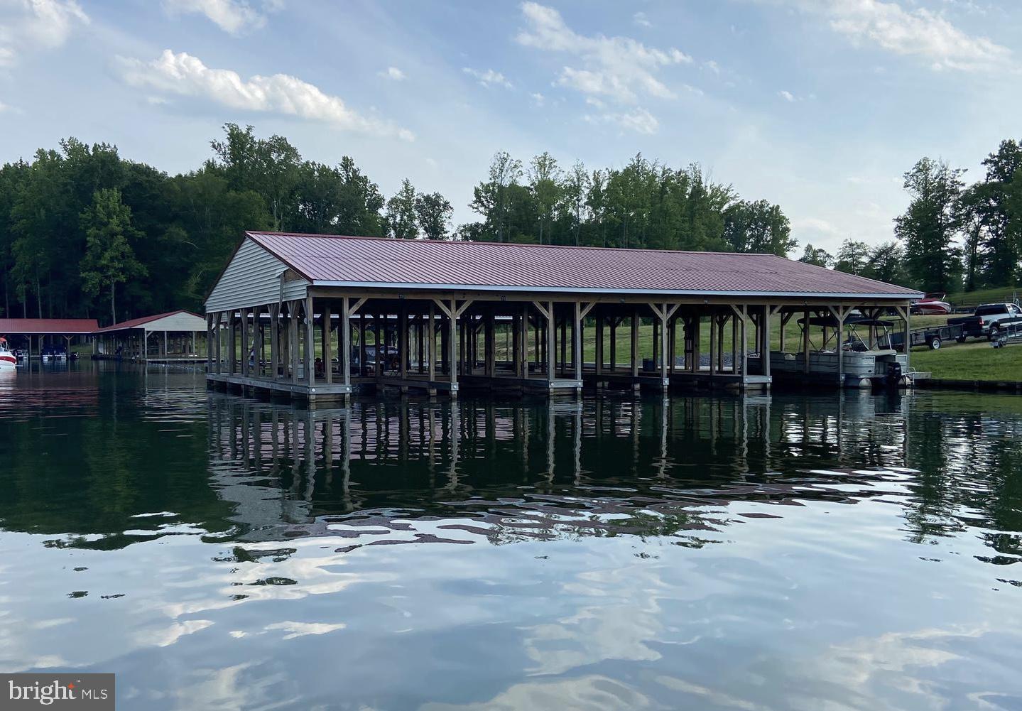 Beautiful and flat water access lot in very popular subdivision at Lake Anna with high speed internet is now available!   A perfect spot to built your lake house on the private side of Lake Anna, located within the Noah's Landing -- one of the most popular subdivisions at Lake Anna.   You will save money when you build your home here because (1) fewer trees to be removed, and (2) you won't have to pay the extra costs to install a septic drainfield on your lot; this is one of the few subdivisions at Lake Anna that has an offsite shared neighborhood drainfield, which saves you money, and gives you much more flexibility and space on your lot when you build your home!   From your lot you can walk to the water and the great neighborhood common area, where you'll find a host of fantastic amenities, including basketball courts, tennis courts, picnic gazebo, a boat launch, and more.   Covered boat slips can be purchased from the HOA!  Superb location: only about 10 minutes from groceries, local restaurants, The Lake Anna Tap House, Coffee & Cream, ABC store, vet clinic, fast food, nail salon, and more, and roughly just 45 minutes to Richmond, Charlottesville, and Fredericksburg.  Just 90 minutes south of Washington DC!