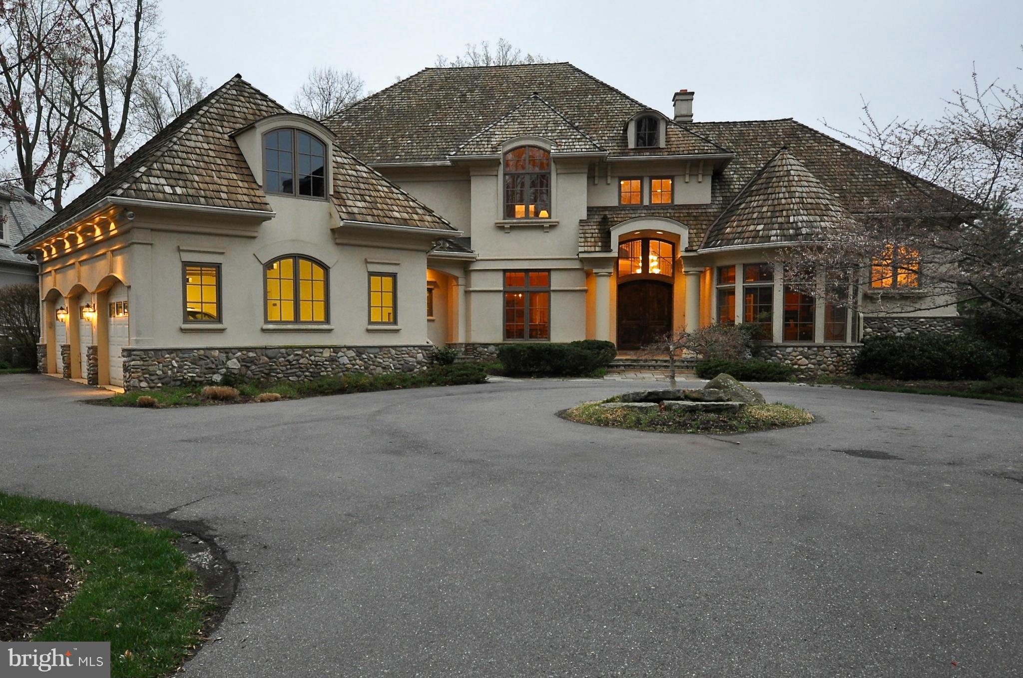 6440 sqft 4-lvl architectural treat w/10' ceilings, hrdwd floors, soaring windows, custom built-ins. Gourmet kit w/custom cabs, eating bar & morning room. Prvt master suite w/cork flrs & gas fireplace. Huge BRs with en suite bathrooms & 9' ceilings. 4 game rooms, home gym, multi-tiered projection home theater. Prvt secure gated community, walk to pool & tennis. HD video tour & 400+ photos avail.