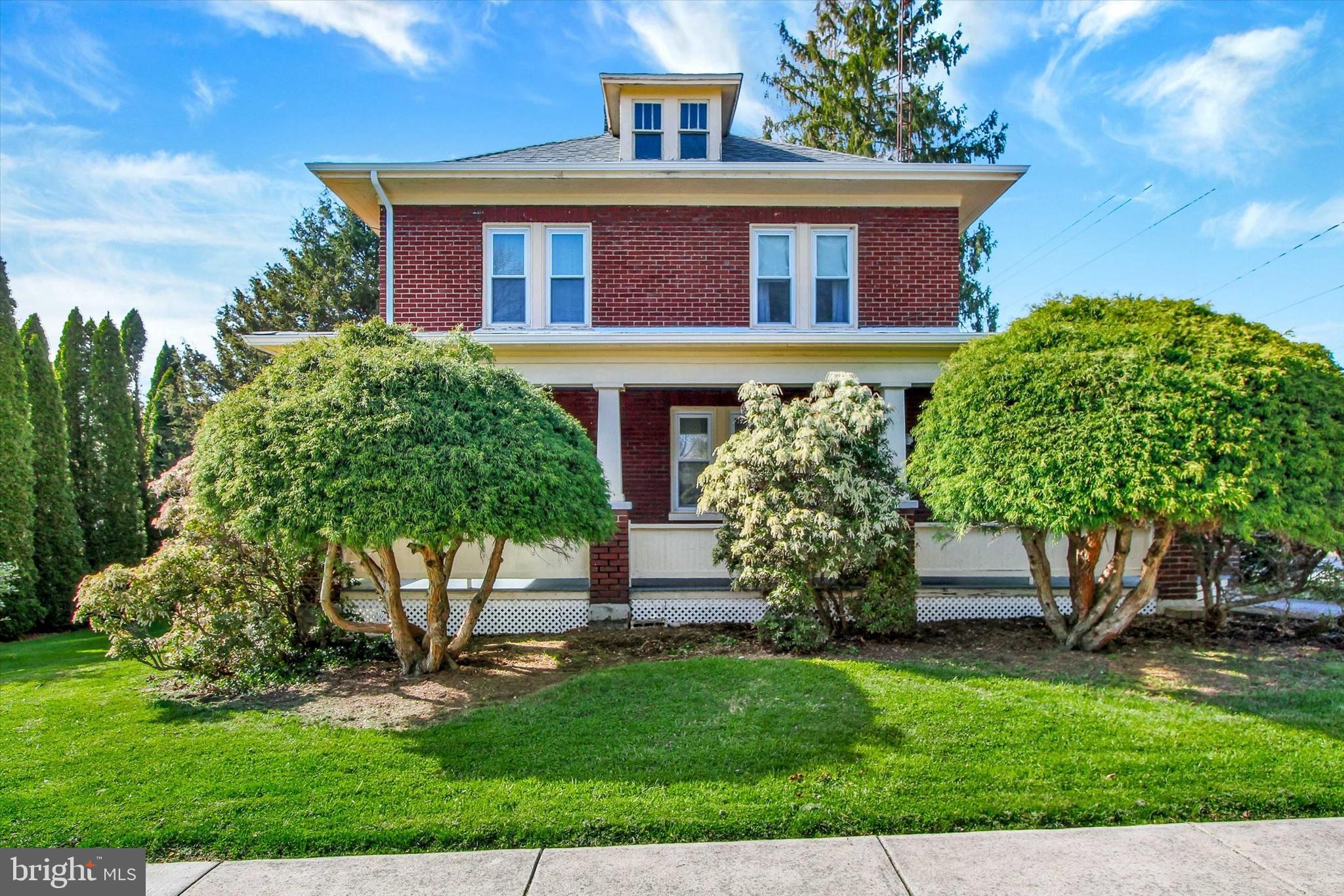 UPDATED ELECTRIC (2026), NEWER ROOF (2024), NEW PATIO (2025)! Tucked into the heart of Mount Wolf, this well maintained 4-bedroom, 1.5-bath home blends timeless character with thoughtful updates—offering a space that feels both warm and unique.  Built in 1920, this home, located in Northeastern School District, immediately stands out with its classic charm, including original stained glass windows, outdoor light fixtures and even a historic outhouse!  A large front porch spanning the entire length of the home creates the perfect spot to relax on a porch swing or rocking chairs and enjoy the neighborhood. Inside, you’ll find spacious living areas and a flexible layout designed for everyday living. The recently updated main bathroom brings a fresh, modern touch, while the rest of the home maintains its character. Natural light fills the sunroom (WINDOWS REPLACED 2025)—ideal for morning coffee or a cozy reading nook—while the enclosed porch offers even more versatile space for entertaining, hobbies, or a quiet retreat. Step outside to a fully fenced, beautifully landscaped backyard that truly sets this property apart. Enjoy a brand-new patio added in 2025, perfect for hosting, a peaceful pond that adds a sense of serenity, and a unique multi-story outbuilding with endless potential—whether for storage, a workshop, or future garage use.  This is the perfect opportunity for a buyer who appreciates character, values outdoor space, and wants a home that’s ready to enjoy from day one! Schedule your showing today and see why this one stands out from the rest!
