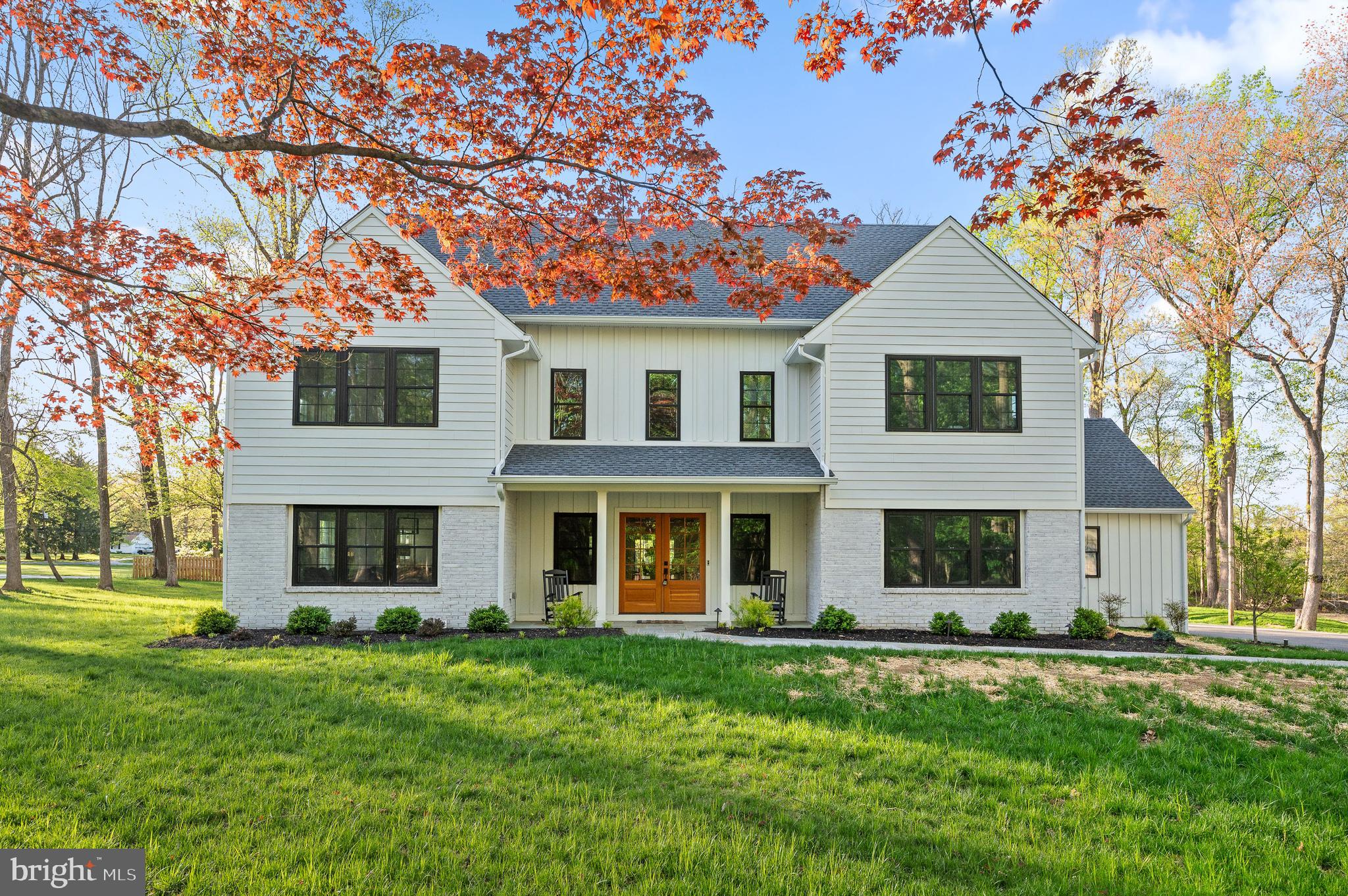 Situated on a sprawling corner lot in Malvern, this new construction, modern-
farmhouse style home radiates luxury and craftmanship at every turn. From the
side driveway, a stone walkway leads to the front porch with glass panel,
architectural double doors. Inside, the glorious, two-story foyer highlights the
home’s open, contemporary design and high-end finishes throughout, including
white oak hardwood floors, nine-foot ceilings, a custom open staircase and
upgraded woodwork. Just off the foyer sits a sun-drenched living room that’s ideal
for cozy gatherings and chats. The dining room beyond offers the space and
flexibility for any occasion, from large dinner parties to intimate family meals.
Food prep and entertaining are a breeze thanks to the open-concept chef’s kitchen
with commercial-grade appliances, nine-foot island, custom tile backsplash and
ample cabinetry. An adjacent breakfast area offers a casual space to dine and gather
with glass sliders that open to the rear patio and greenspace. The kitchen also
connects to a smartly designed mudroom with plentiful storage, bench seating, a
custom canine shower and direct access to the three-car garage. Additional main floor
highlights include a luxurious open family room with beautiful custom millwork and marble fireplace, two powder rooms and a front office with shiplap accent wall and French doors for privacy.
Take the distinctive open staircase to the second floor, where you’ll find a
sumptuous primary suite featuring a walk-in closet with center island and ensuite
bath with oversize vanity (over 20 feet long!) and extra-deep marble shower. This
floor also houses three secondary bedrooms—one with an ensuite bath and two
connected via jack-and-jill bath—plus a spacious laundry room. The finished
basement provides even more space for relaxation and play, and plenty of storage. Outside, nearly three acres of flat, professionally landscaped greenspace and a rear slate patio offer a peaceful,
relaxing respite in the heart of scenic Willistown Township. Located less than two
miles from downtown Malvern and zoned for top-ranked Great Valley School
District, this exceptional property is also close to Malvern Prep, two transit stations
and Radnor Hunt Club. Current owner added many upgrades to the property including hardwood floors in on the second floor, expanded and upgraded the patio to stone,  and much more!