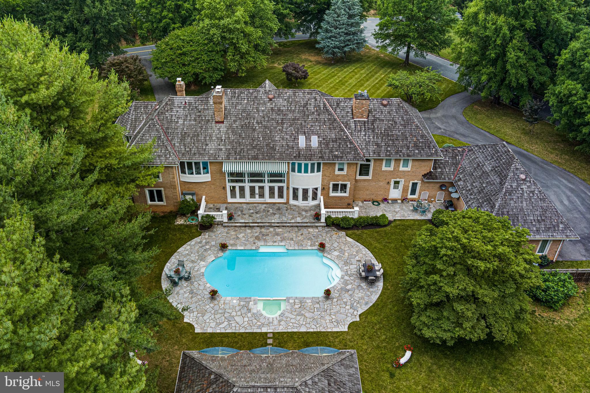 Welcome to 8812 Mary Mead Ct.  1% Rate Buy Down No Additional fees for BUYER 
Potomac Living at its Best! - This Stunning 4-sided Brick Manor Home Nestled in the Legendary Falconhurst Neighborhood, surrounded by A Natural Oasis that's Teeming with an Array of Rare Birds and Wildlife. As you approach The Home's Circular Driveway, You'll Immediately Feel A Sense of Privacy and Exclusivity.
Upon Entering The Home's Double Mahogany Doors, you'll be greeted By A Breathtaking Custom Staircase that was Once Featured in Architectural Digest. The Grand Foyer Boasts Soaring Ceilings and Marble Floors, setting the tone for the Enchanting Design and Style that permeates every inch of this home.
As you make your way through The Main Living Area, you'll be struck by the Abundance of Bright Natural Sunlight and Designer Finishes that Dazzle the Eyes and the Heart. The Expansive Great Room Seamlessly Flows into the Glamorous Kitchen, which features Top-Of-The-Line Appliances from Wolf, Dacor, Subzero, and A Custom Viking Double Oven. The Large Dining Room Offers Direct Line Views of The Impressive Landscaping. This Home Features A Wing Dedicated to Entertaining on a very large level which includes one of the largest butlers pantry in the DMV and an extra large extra wide 4 car garage.

This Gracious Home also Boasts One Of The Largest Fully-Paneled CEO Office with Custom Brass inlay in the Brazilian Cherry Flooring. As you head up The Grand Staircase, you'll find The Most Luxuriously Appointed Primary Suite, Complete with an Enormous Sitting Room, 6 Unbelievable Closets, and a Spa-Like Bathroom with a Large Jacuzzi Tub that Offers Stunning Views in Every Direction.
But The Real Showstopper is The Enchanting Backyard with Extensive Hardscaping and Landscaping Designed By A Renowned Landscape Designer. The Massive Multi-level Patio Features Three Shaded Areas with A Pool and Pool House Complete with Living Room, Kitchen, Full Bathroom and Separate Changing Area. The Fully Fenced Backyard Provides Privacy And Security, while the 12-zone Sprinkler System Ensures The Landscaping Remains Lush and Green. Additionally, The Home has 800 amps of Electricity and A Commercial Grade Gas Generator. The Newly Finished Walk-up  Basement Offers An Expansive Space Perfect For Entertaining with a Home Theatre and a Real Gym, as well as In law Suite with Full Bath. Impressive Storage Rooms Provide Ample Storage Space For All Your Needs. Huge unfinished area over
4 car garage can also be easily converted into maid's quarters, large gym or bonus space.
8812 Mary Mead Ct, the epitome of elevated living for those who've always sought the extraordinary. Perfectly positioned in the prestigious Falconhurst, Potomac, MD, this grand home is a testament  of superior new construction paired with unmatched elegance. Designed especially for the Bon Vivant with a penchant for world-class luxury, this home offers 5 lavishly-appointed bedrooms, a lavish outdoor patio seamlessly transitioning to a sprawling 2 acres of perfectly manicured landscaping— setting the stage for a life of unparalleled outdoor entertaining.
. Sunlight streams through vast windows, casting a shimmering glow on the hand-picked finishes that add splendor to every nook and cranny.
At its heart lies a gourmet kitchen, intricately designed for those who find pleasure in the gastronomic arts. Every detail, from the bespoke cabinetry and cutting-edge appliances to the timeless  beauty  has been tailored to inspire culinary wonders. Whether curating an intimate dinner or hosting a grand soirée, this space is your stage.
This Extraordinary Home is shown By Appointment Only, so don't wait - Schedule Your Private Tour Today and Experience The Very Best of Elegant Living!1
