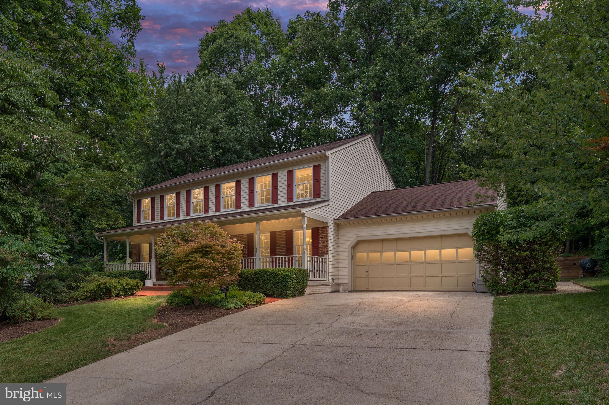 OPEN HOUSE SAT 6/27 1-3PM- JUST STOP BY!! Welcome to this beautifully maintained colonial nestled on a private, wooded lot in one of Reston's most desirable communities. Offering 5 bedrooms, 2.5 updated baths, and thoughtfully renovated living spaces, this move-in ready home combines timeless charm, modern updates, and an unbeatable location.

A welcoming front porch leads into a freshly painted interior (2022) featuring crown molding, luxury vinyl plank flooring throughout much of the main level, and a traditional floor plan with spacious living and dining rooms. The inviting family room is anchored by a cozy propane fireplace, while the renovated kitchen boasts white cabinetry, quartz countertops, stainless steel appliances, a stylish backsplash, recessed lighting, and a large peninsula with seating. The adjoining breakfast area overlooks the peaceful, wooded backyard.
Step outside to the expansive deck, perfect for entertaining, dining, or simply enjoying the private setting surrounded by mature trees.

Upstairs, all five bedrooms are conveniently located on the same level. The spacious primary suite features a custom walk-in closet and a beautifully renovated spa-inspired bath with dual vanities, a soaking tub, and an oversized walk-in shower. Four additional bedrooms offer flexibility for family, guests, or home offices and share an updated hall bath with dual sinks. A renovated powder room serves the main level.

The unfinished walkout lower level offers exceptional potential for future living space, including room for a recreation area, bedroom, bathroom, gym, and abundant storage. Additional updates include a new roof (2021), fresh interior paint (2022), and a LiftMaster garage door opener (2024). An attached two-car garage completes the home.

The location is exceptional. At the entrance to the neighborhood is a community park with a playground, basketball court, reservable pavilion, and tennis/pickleball courts. Directly across the street, enjoy access to Sugarland Run Trail, connecting to Reston's extensive trail system and the W&OD Trail.

Within approximately one mile are two Reston Association pools, additional tennis and pickleball courts, and North Point Village Center with Giant Food, restaurants, and everyday conveniences. Reston Town Center is just minutes away, offering shopping, dining, entertainment, and seasonal events.

Reston Association residents enjoy access to 15 outdoor pools, tennis and pickleball courts, over 55 miles of walking and biking trails, four lakes, sports fields, playgrounds, picnic areas, and more than 1,300 acres of open space.

Commuters will appreciate quick access to Silver Line Metro stations, Route 7, the Dulles Toll Road, Greenway, and Dulles International Airport, all while enjoying the peace and privacy of this quiet neighborhood.

Combining five bedrooms, tasteful updates, future expansion potential, incredible community amenities, and an outstanding Reston location, this exceptional home is ready to welcome its next owner. Schedule your private tour today!!