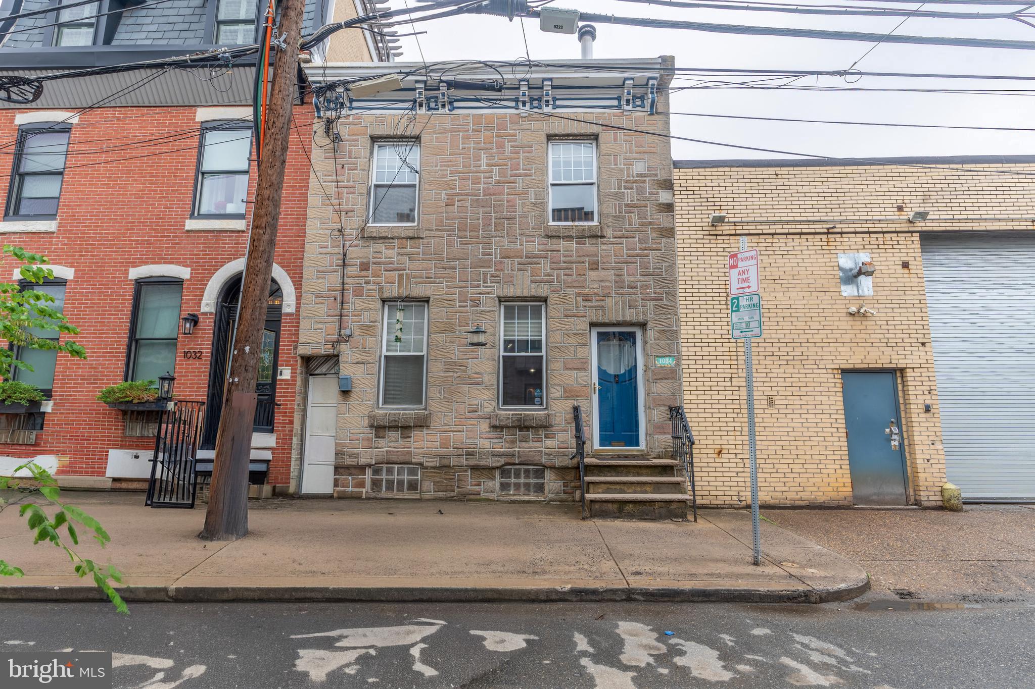 Welcome to this one of a kind 2-bedroom, 2.5-bath home in the heart of highly desirable Fishtown. Offering three full levels of thoughtfully designed living space, this home combines character, comfort, and convenience. The expansive main level features an open-concept layout spanning the entire length of the home, creating an ideal setting for both everyday living and entertaining. A charming wood-burning stove fireplace serves as the focal point of the space, while the spacious kitchen is appointed with granite countertops, a tile backsplash, stainless steel refrigerator, and sleek glass cooktop. Step directly outside to your private rear patio, perfect for relaxing or outdoor dining. A dramatic and custom two-story entry with high ceilings and a custom staircase creates a striking first impression. The second floor offers two generously sized bedrooms, a full hall bath with tub, and access to a private rear deck. The fully finished lower level provides exceptional additional living space and features a wet bar, electric sauna, full bathroom, and endless possibilities for a family room, home office, gym, or guest suite. This move-in ready home also features hardwood floors, convenient laundry, and abundant storage. Ideally located within walking distance to Fishtown's vibrant restaurants, cafes, shopping, and public transportation. Enjoy easy access to Penn Treaty Park, the Delaware River waterfront, and the popular Delaware Avenue walking and biking trail. This is city living at its finest. Seller is a licensed PA Realtor.
